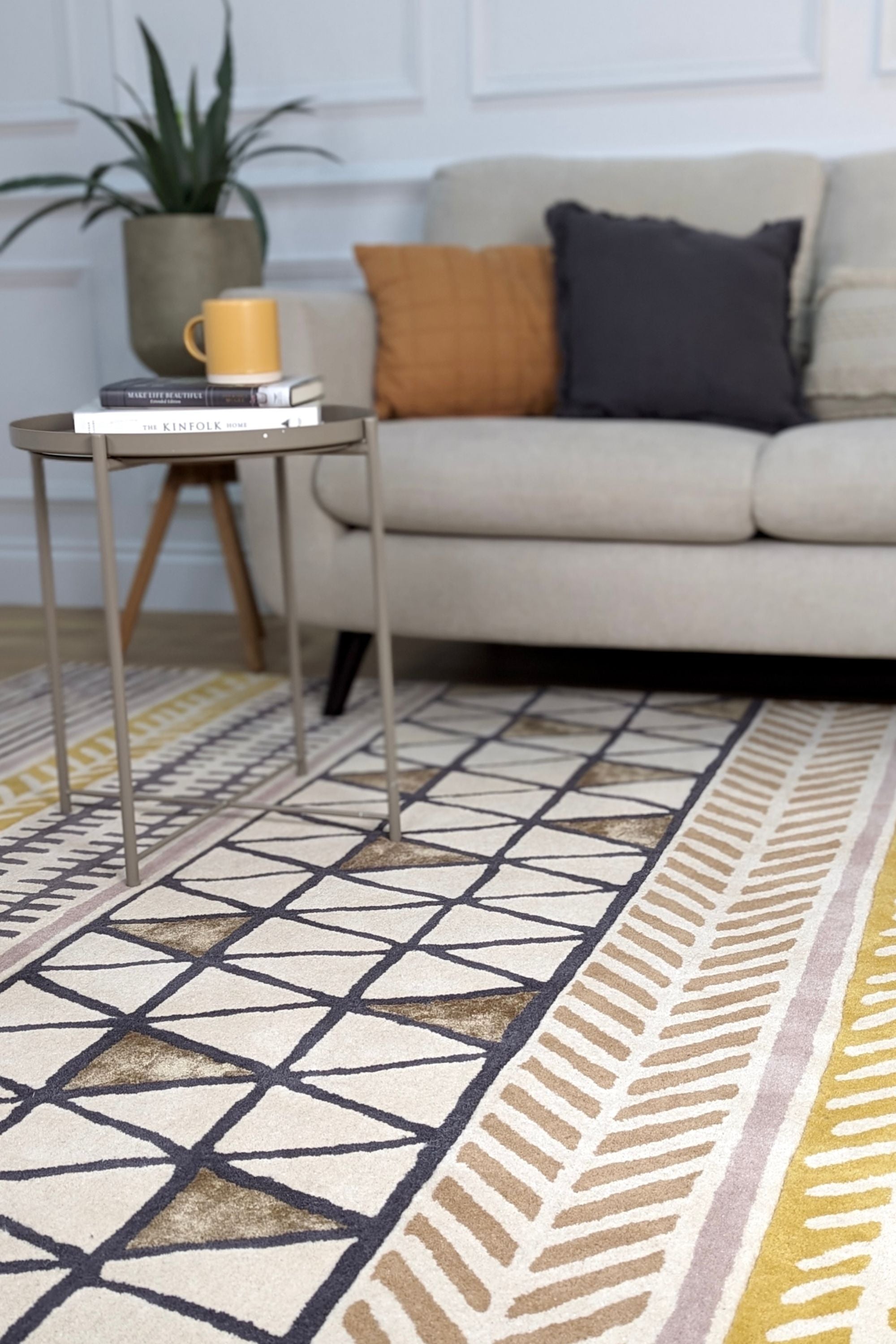 Quirky ethnic inspired pattern in yellow, taupe, cream and grey