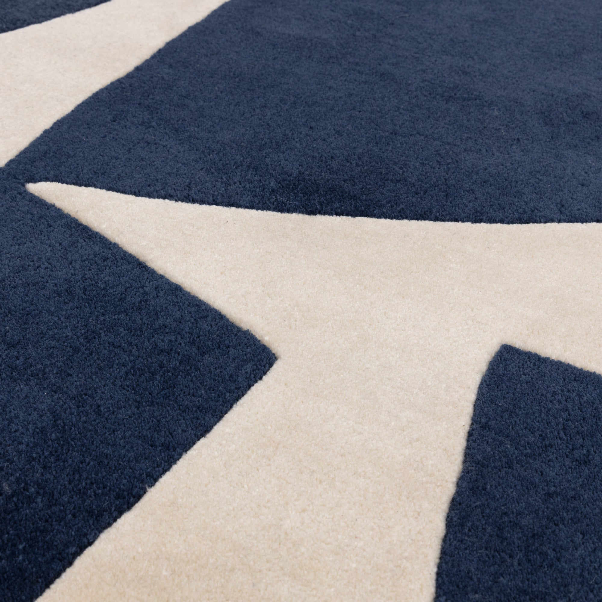 Blue and cream rug with abstract pattern