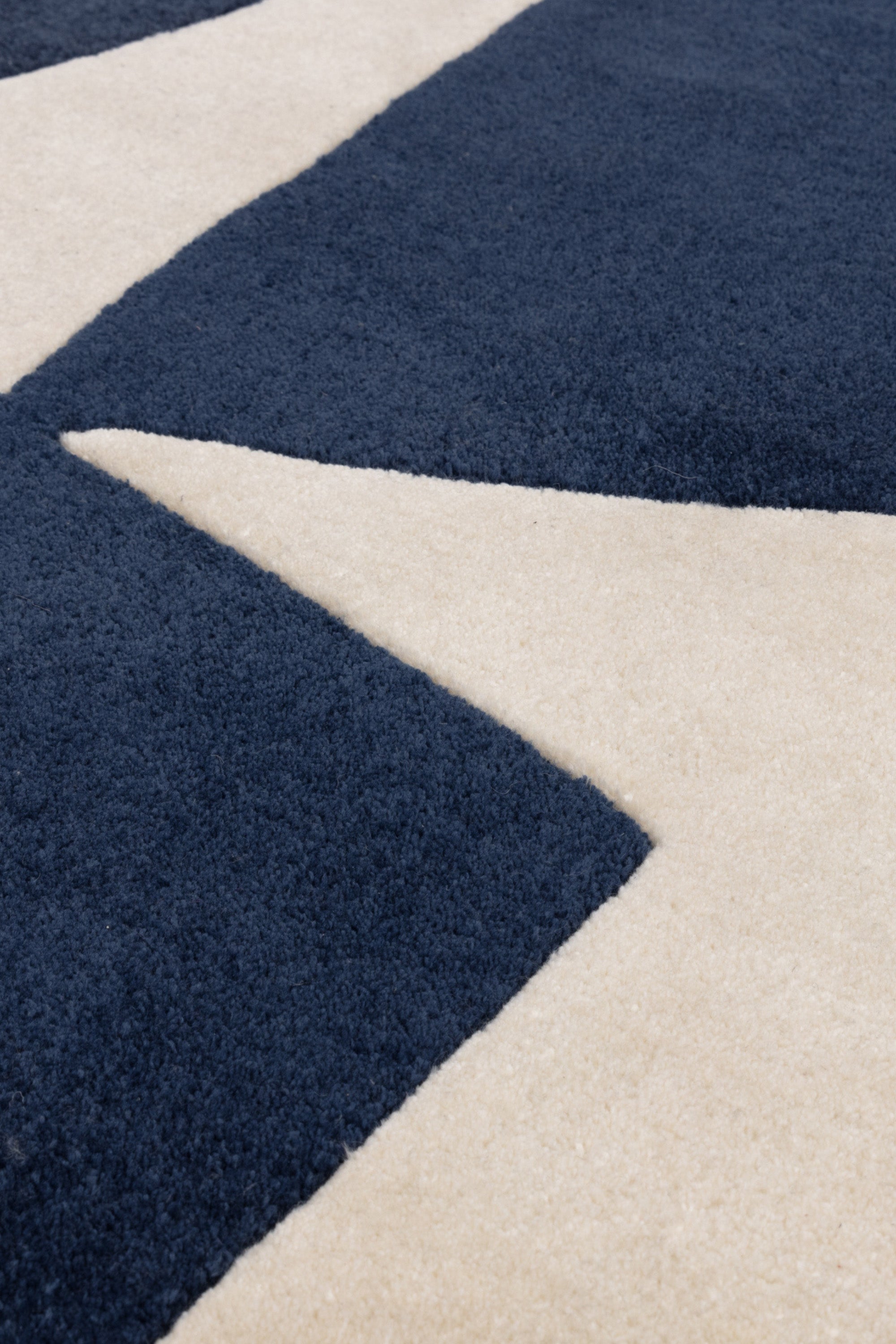 Blue and cream rug with abstract pattern