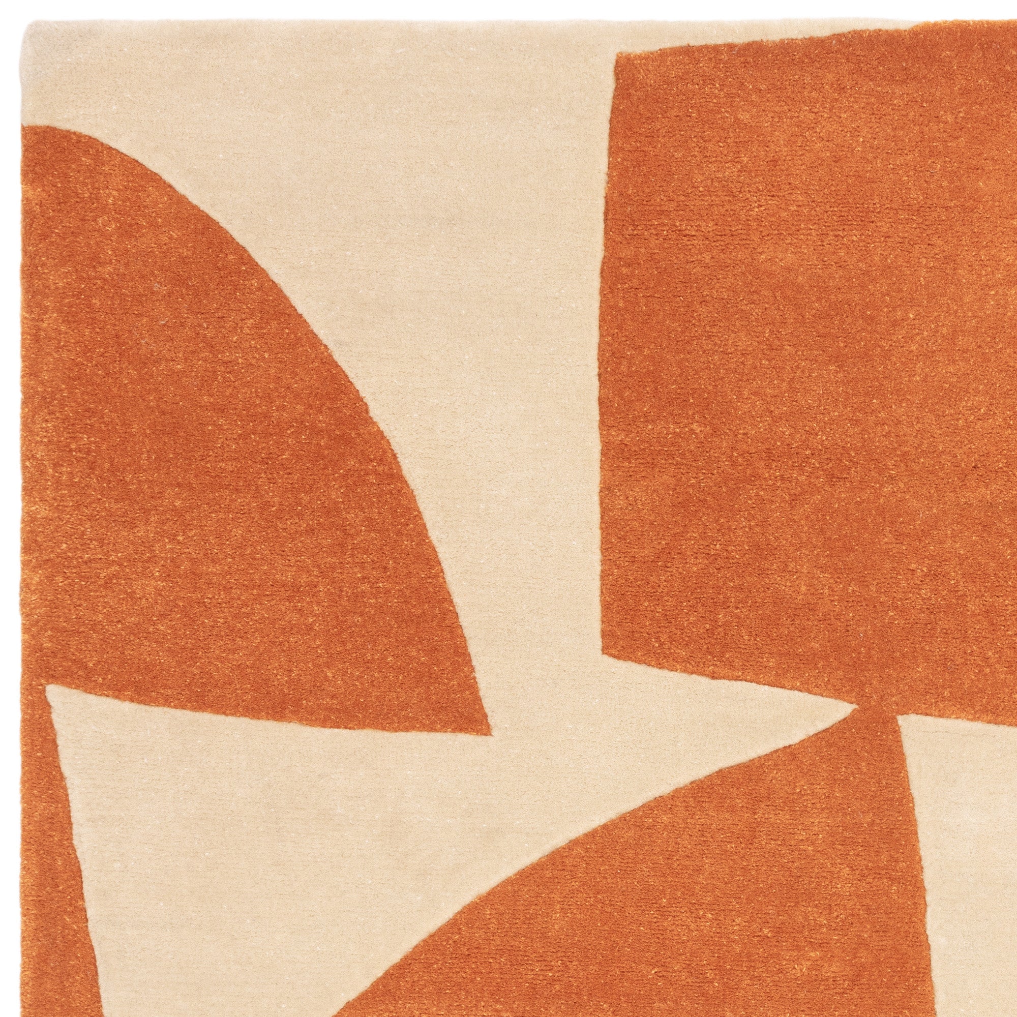 Orange and cream rug with abstract pattern