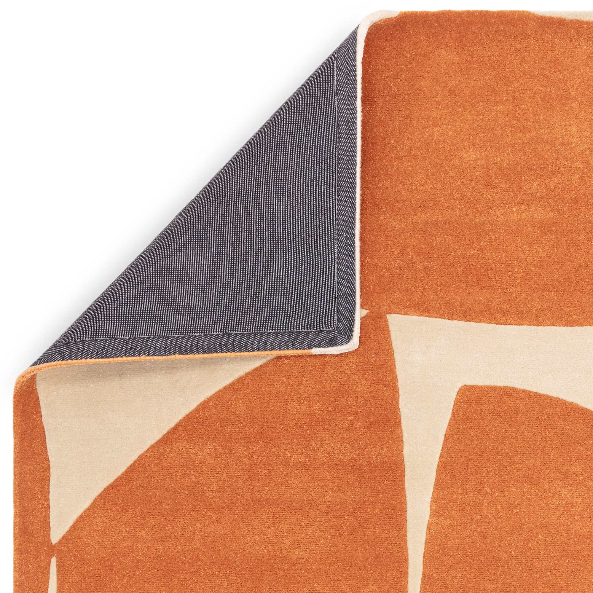 Orange and cream rug with abstract pattern
