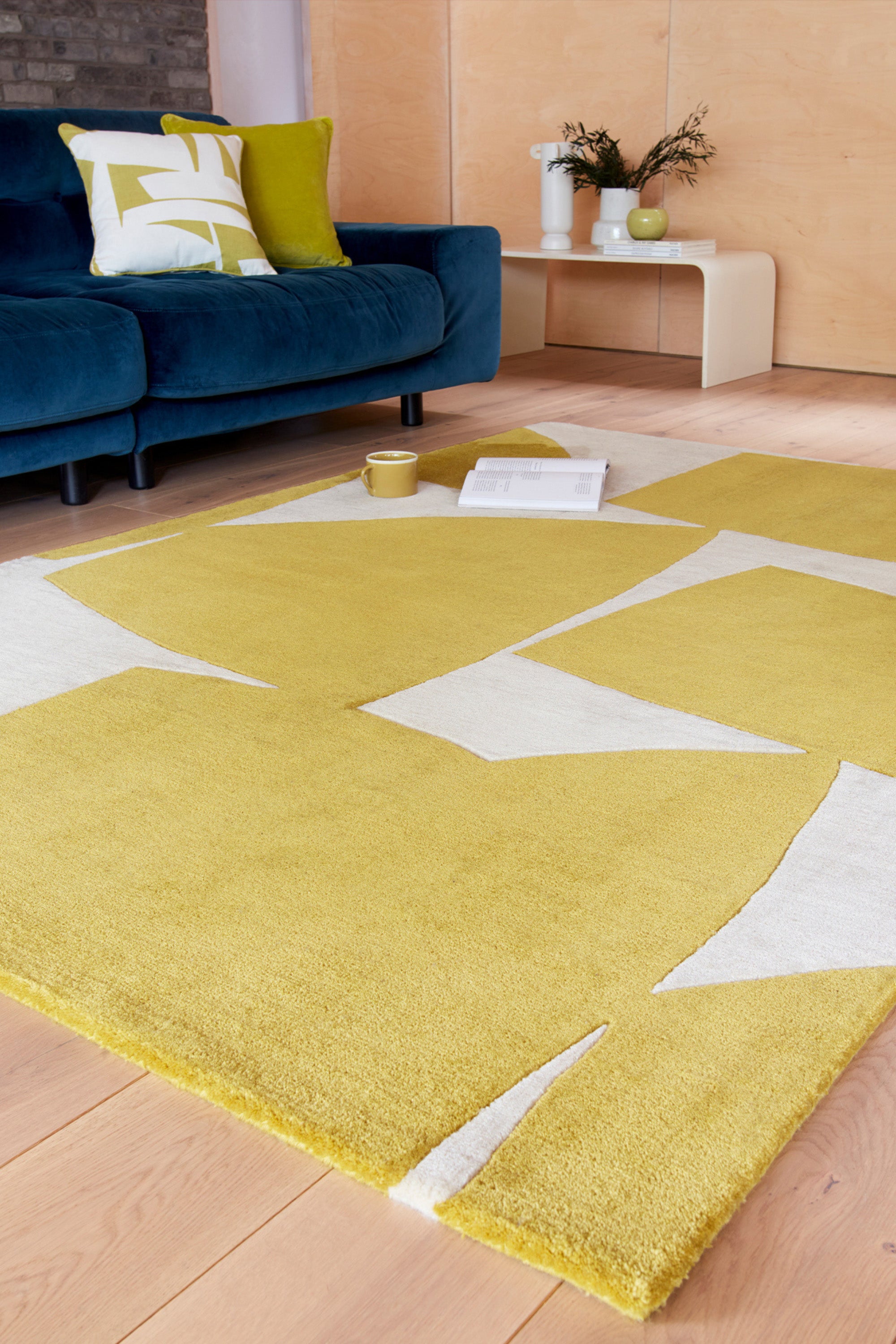 Yellow and cream rug with abstract pattern