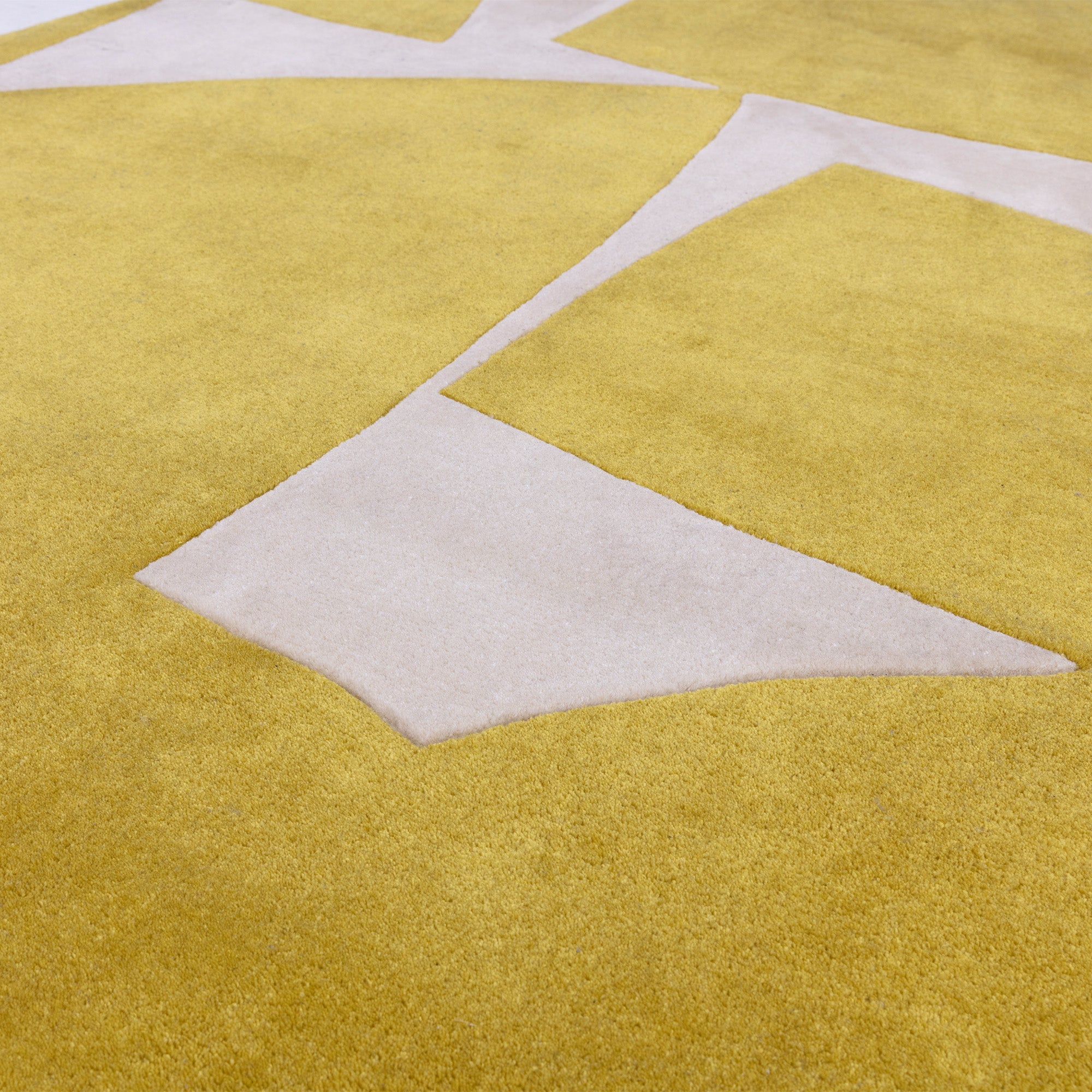 Yellow and cream rug with abstract pattern