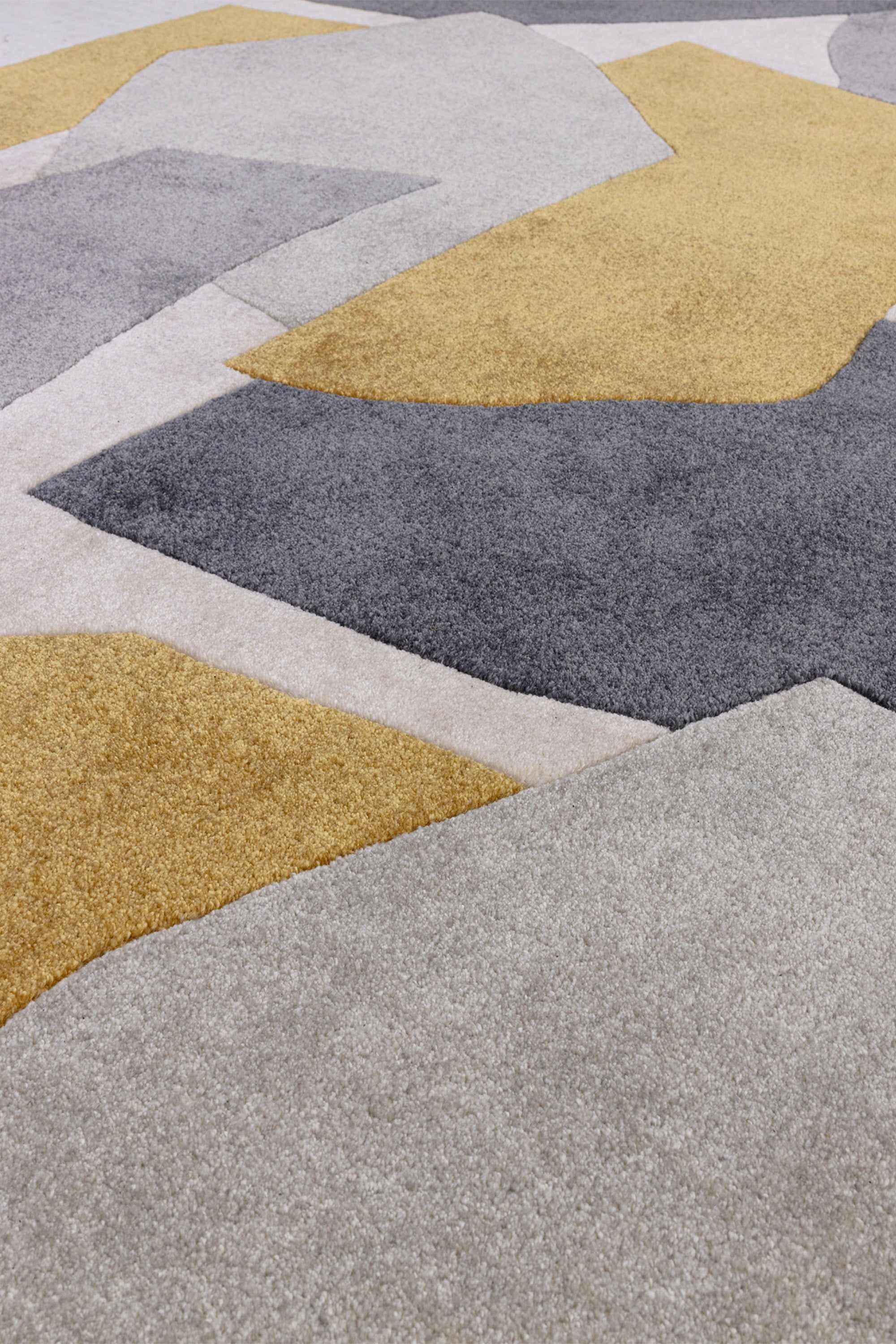 Multicolour rug with abstract pattern in orange, grey, and cream tones