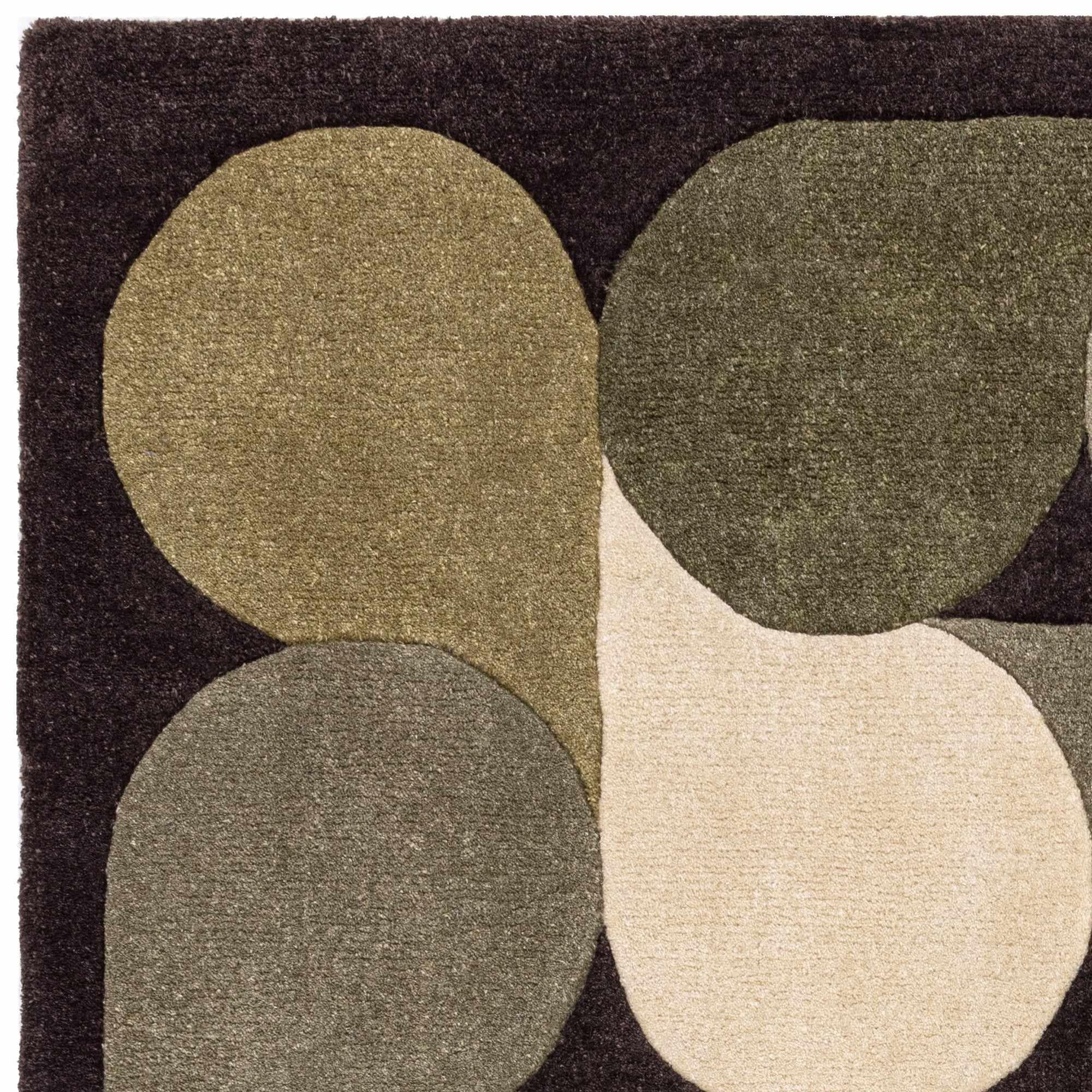Green rug with an abstract pattern