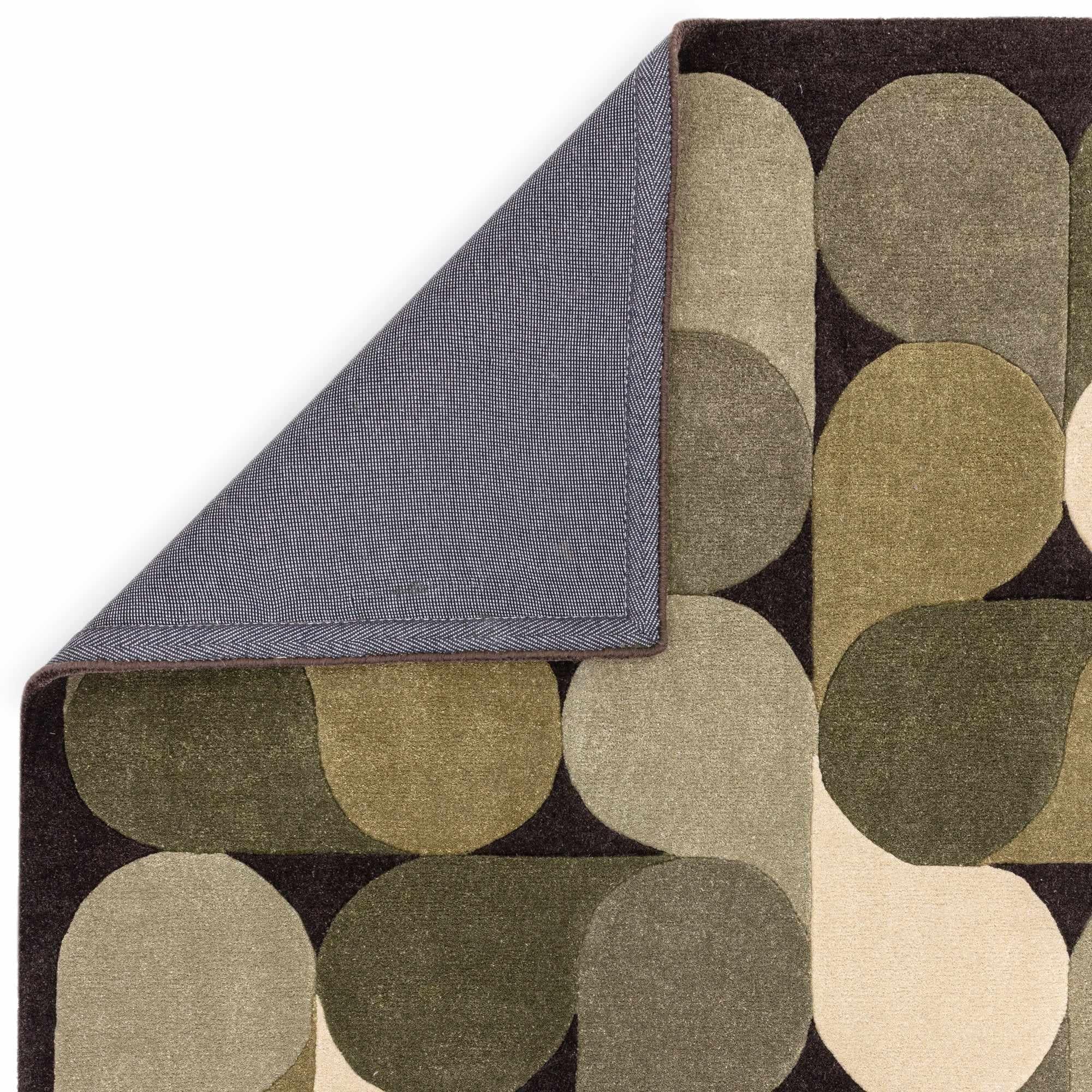 Green rug with an abstract pattern