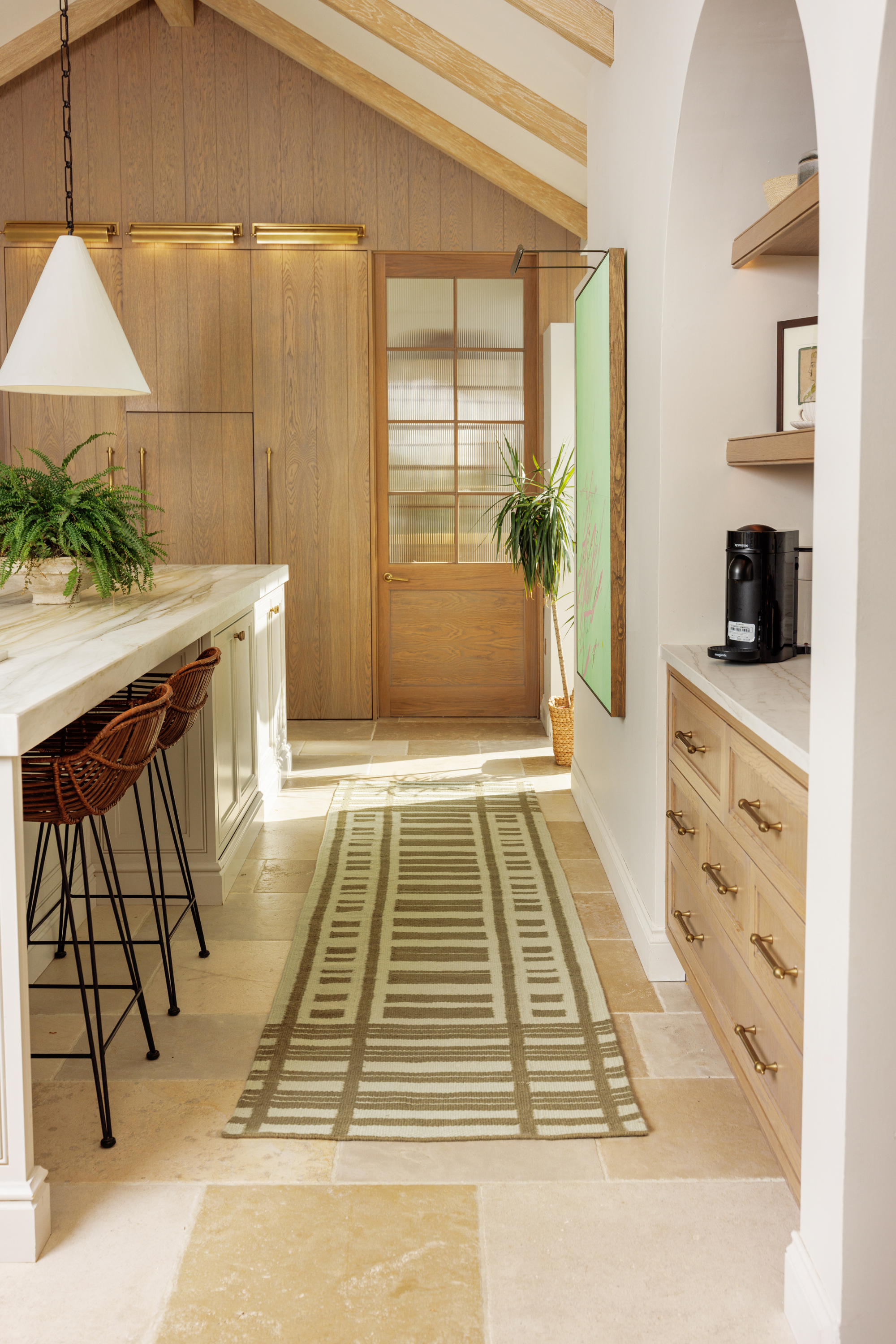 Tonal green wool and cotton runner rug featuring a contrasting linear pattern placed in a kitchen