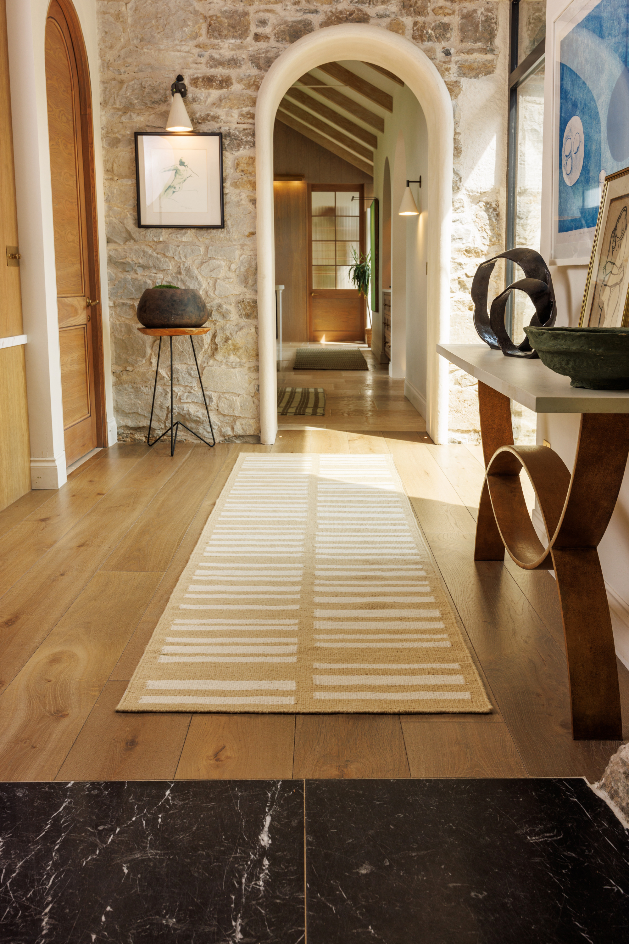 beige and straw toned wool and cotton runner rug featuring an irregular linear pattern placed in a hallway