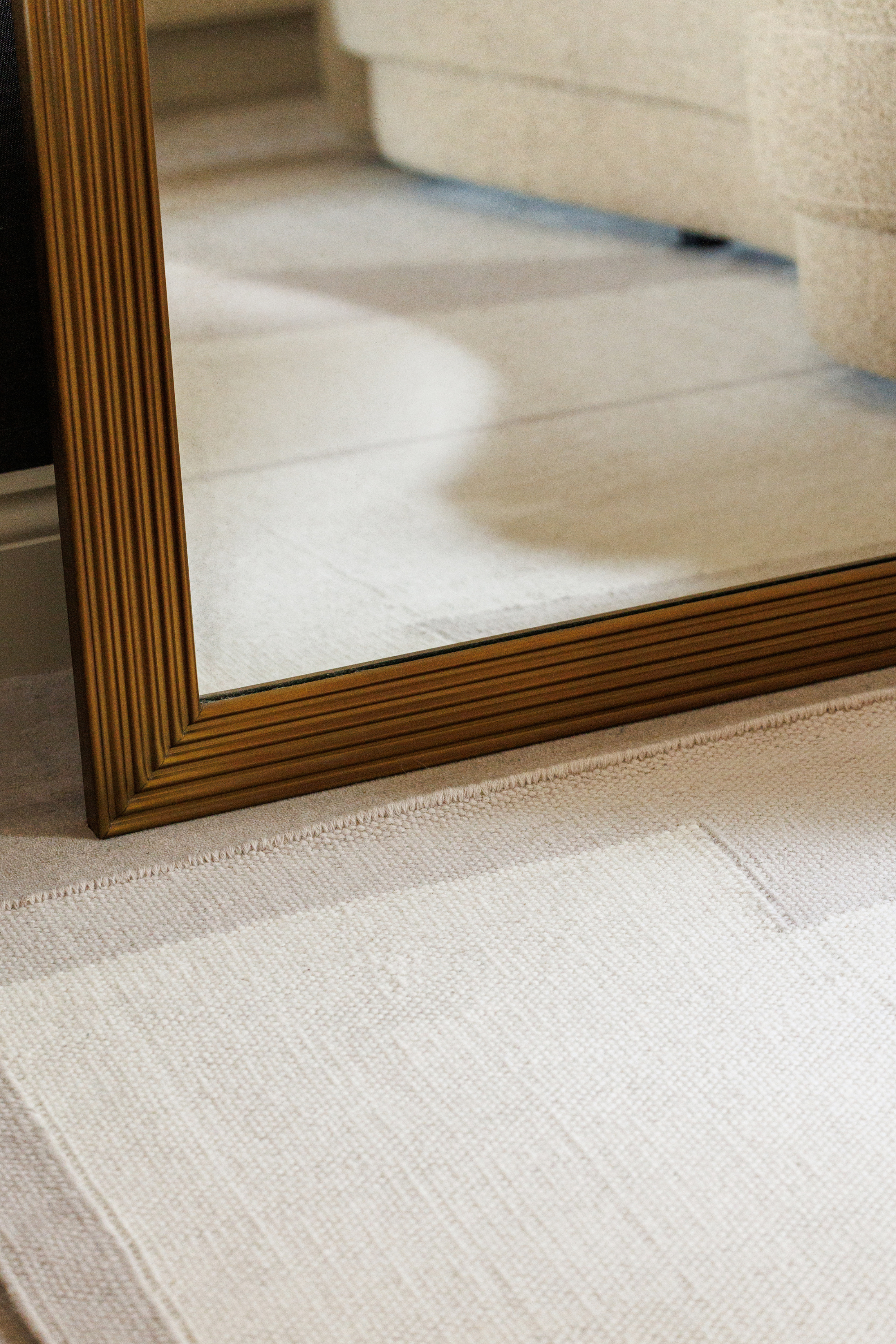 Neutral greige wool and cotton rug featuring an ivory angular design