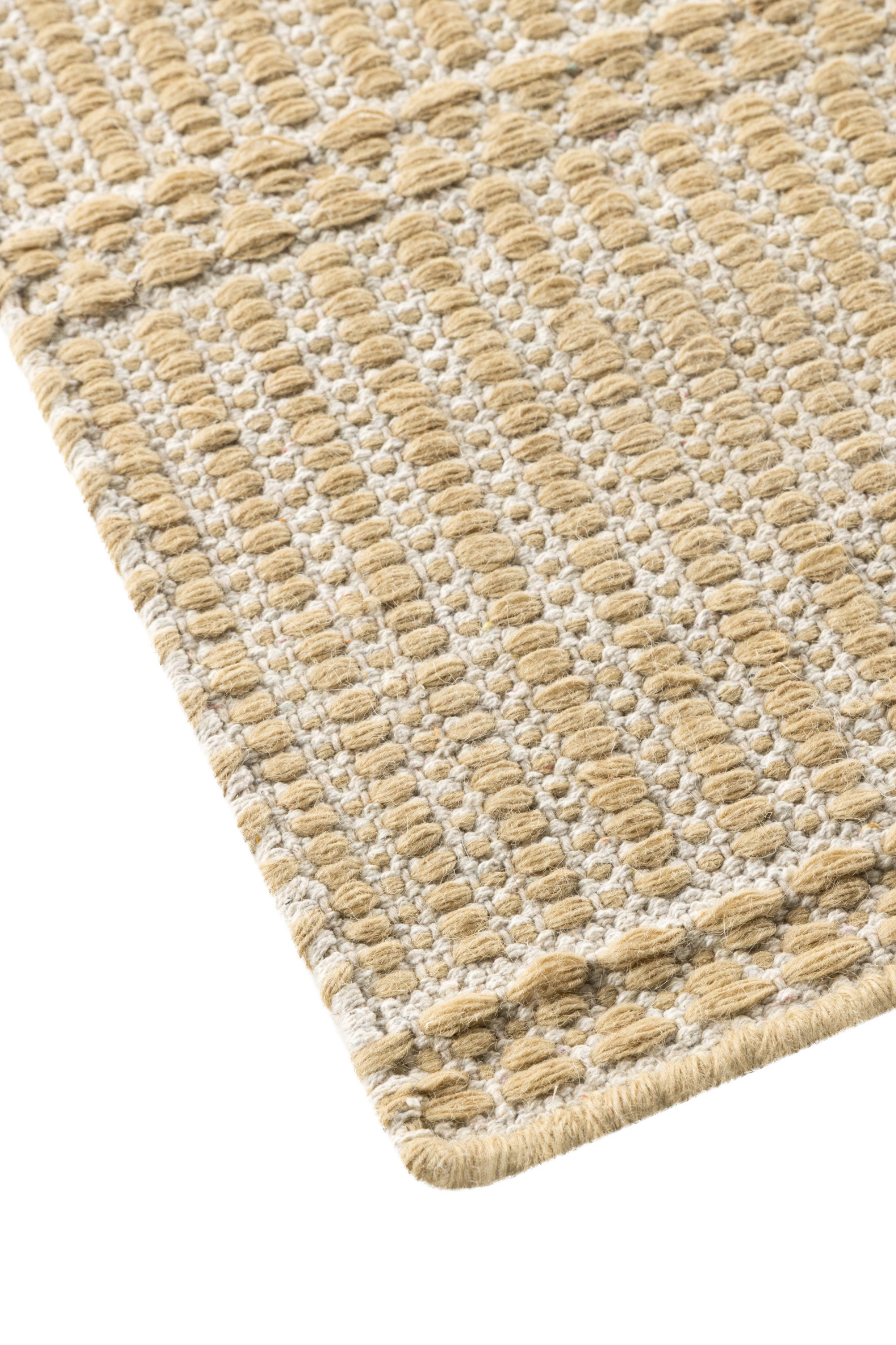 wool and cotton runner rug in a golden straw tone featuring a design inspired by ancient irish script