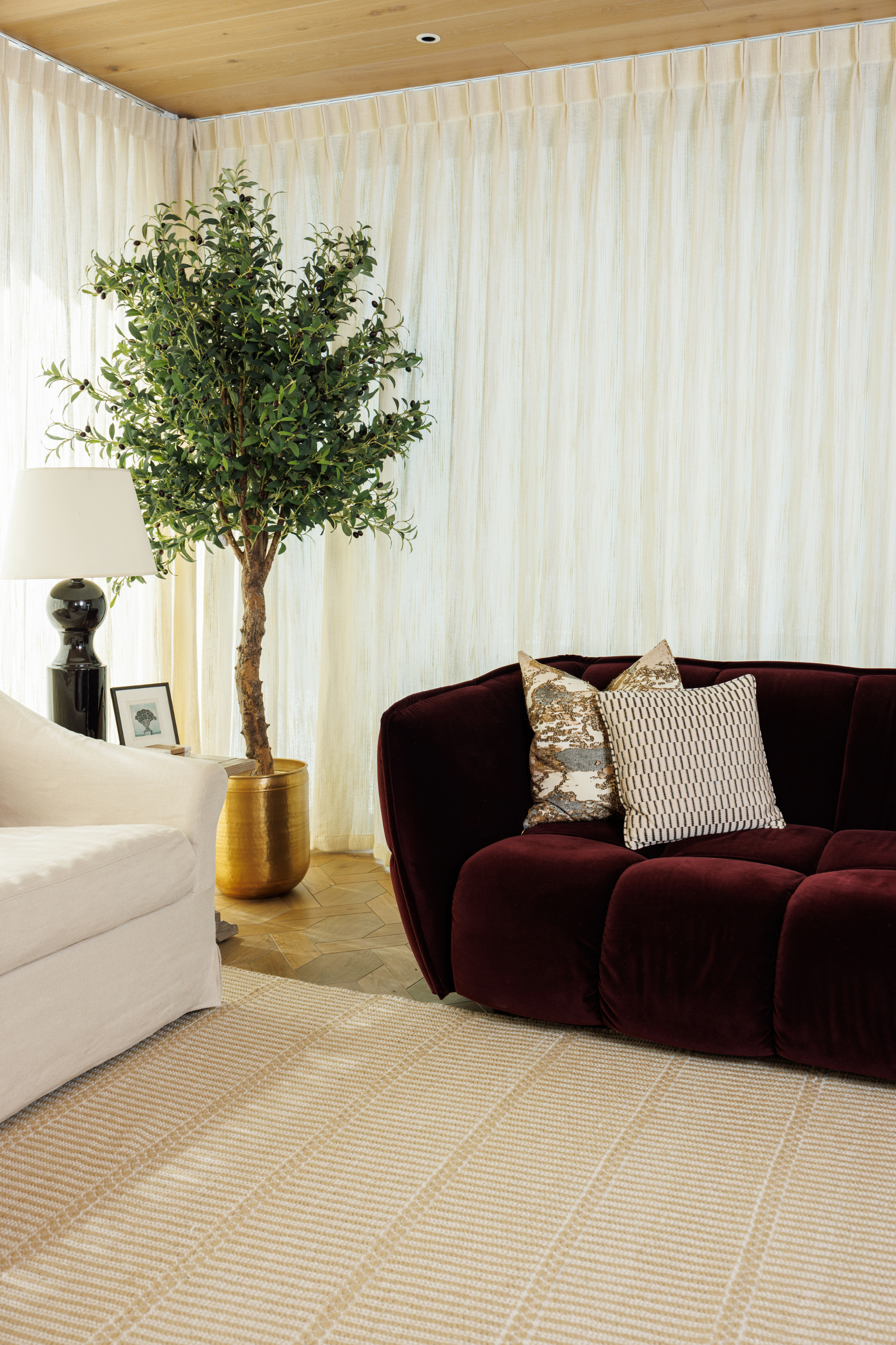 wool and cotton rug in a golden straw tone featuring a design inspired by ancient irish script