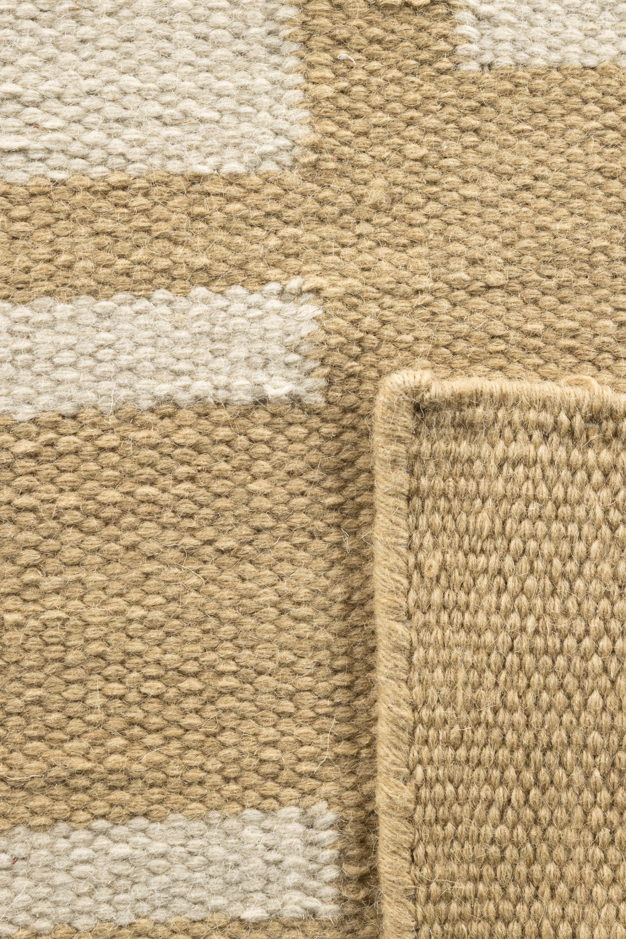 beige and straw toned wool and cotton rug featuring an irregular linear pattern