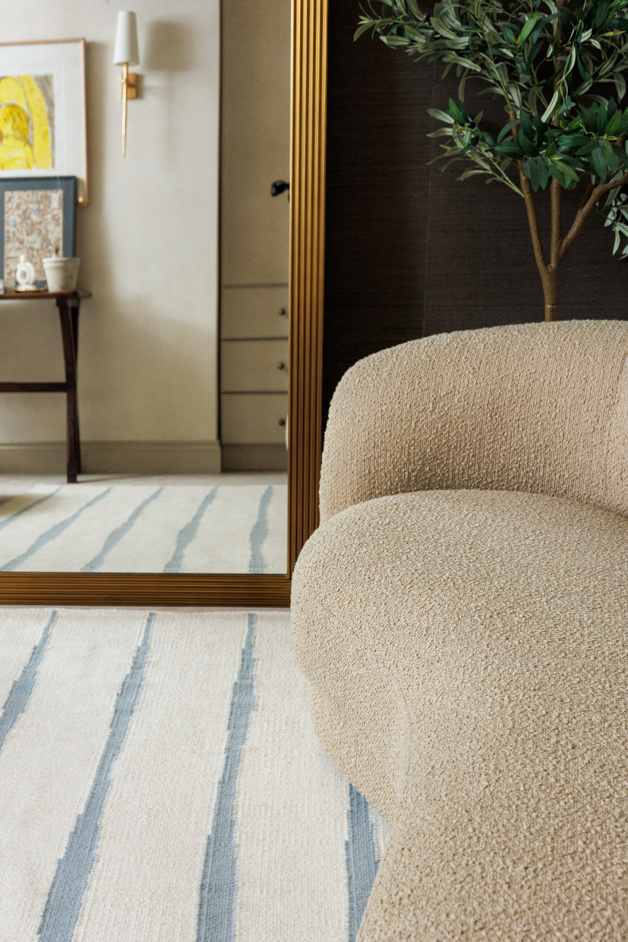 Neutral ivory wool and cotton flatweave rug featuring blue ripple linear lines