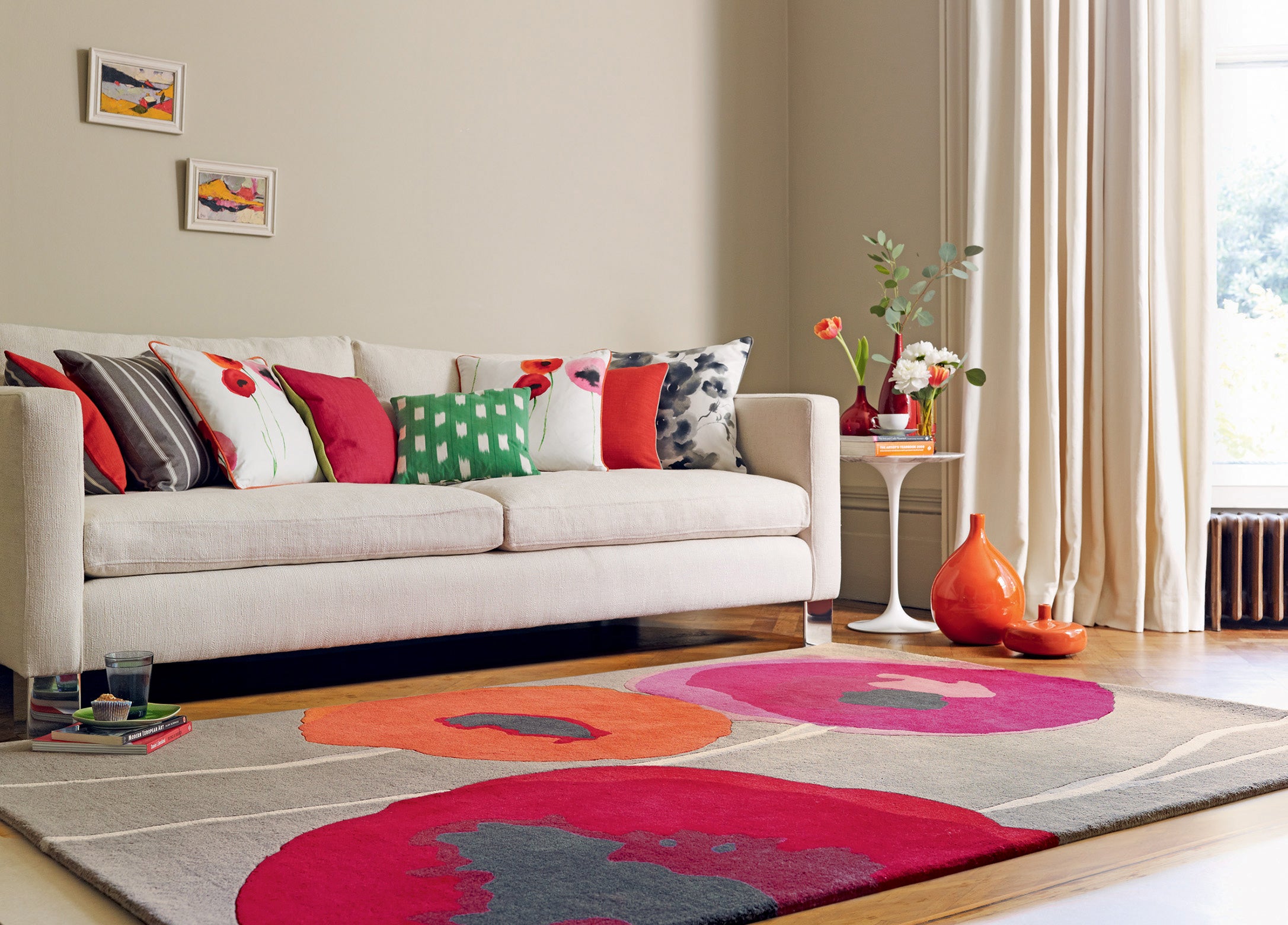 Brown floral rug with pink, red, and orange poppies