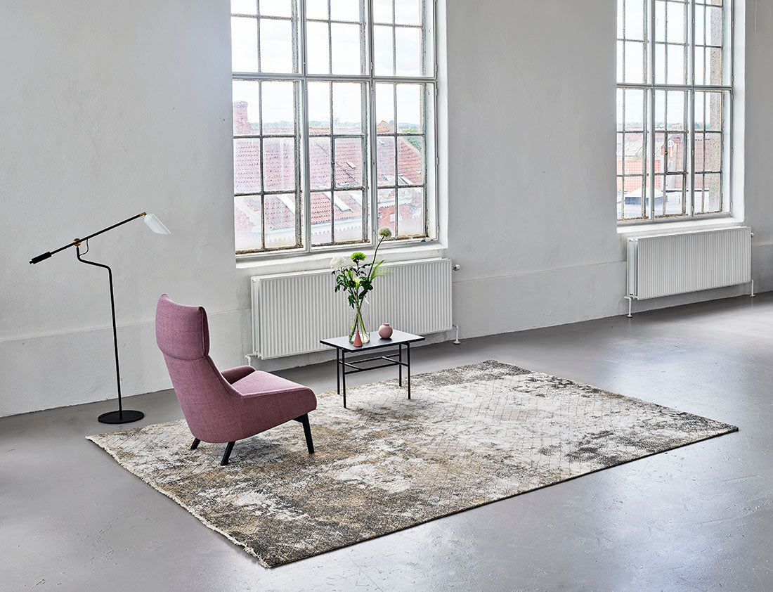 Large area rug with abstract design in grey and beige