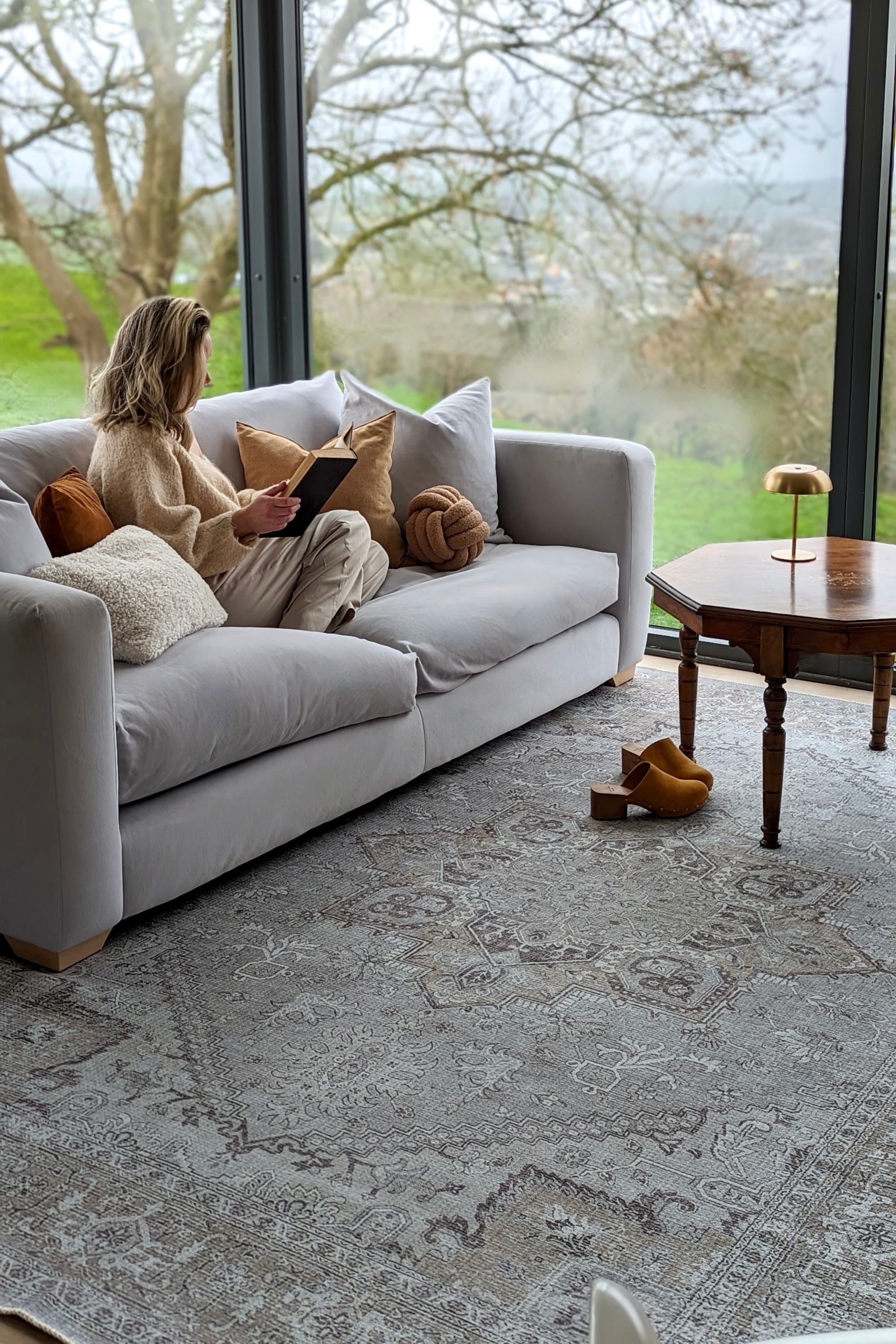 Brown bordered vintage style rug