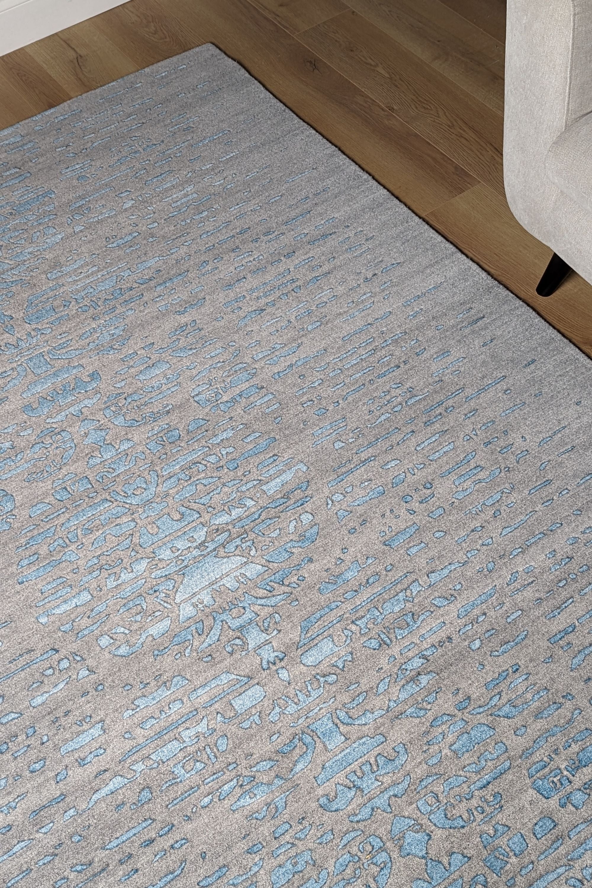 large area rug with abstract damask design in blue
