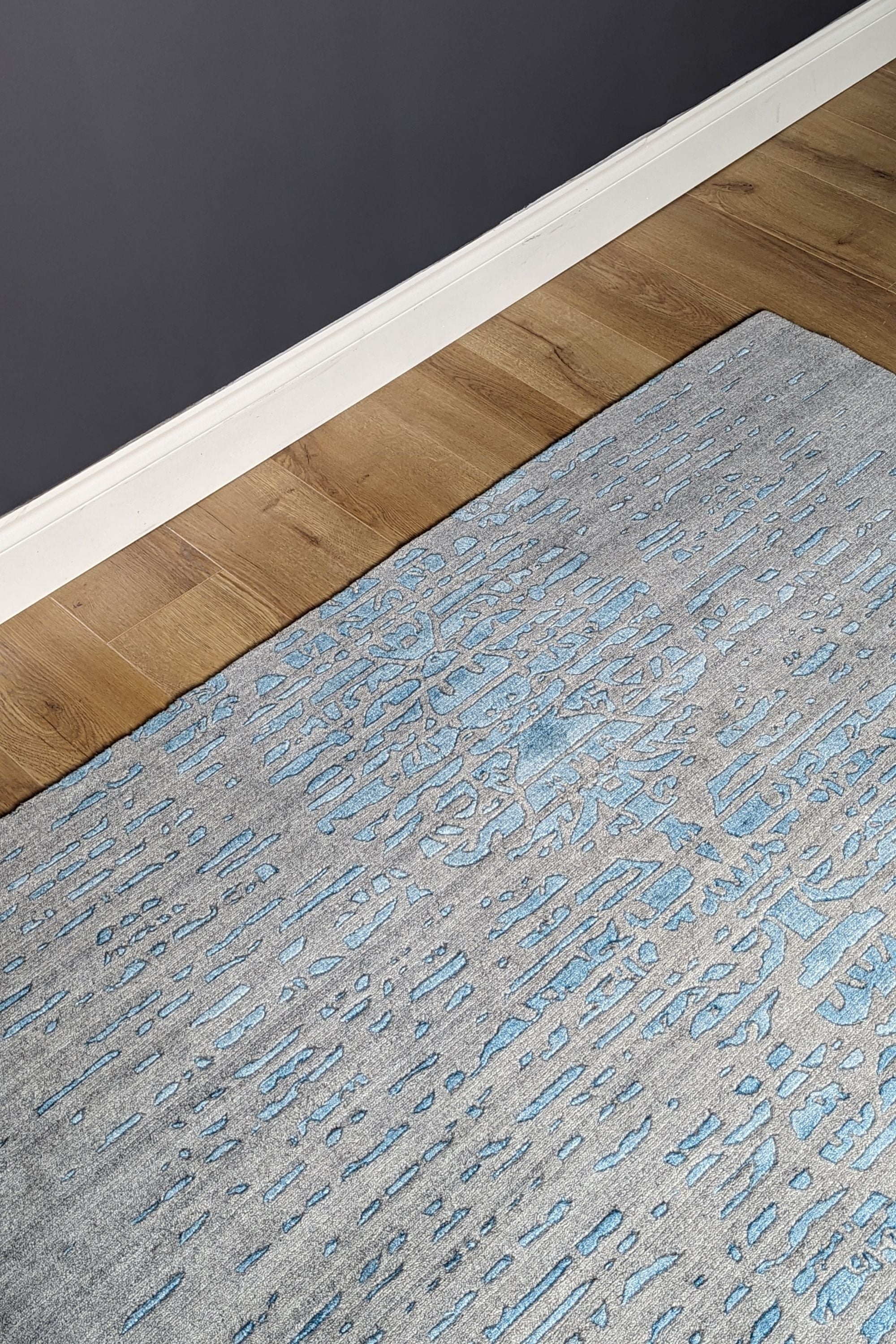 large area rug with abstract damask design in blue