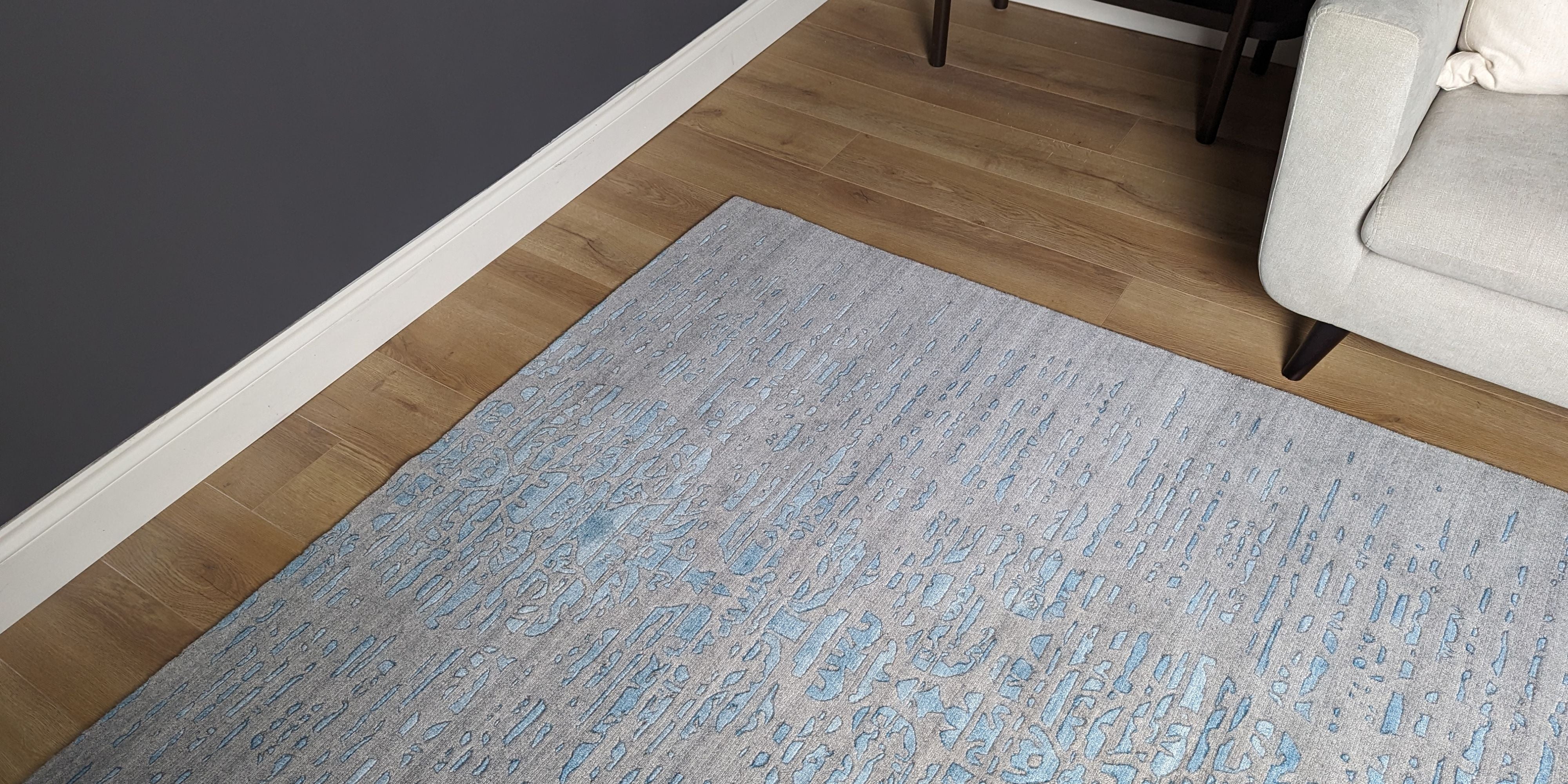 large area rug with abstract damask design in blue