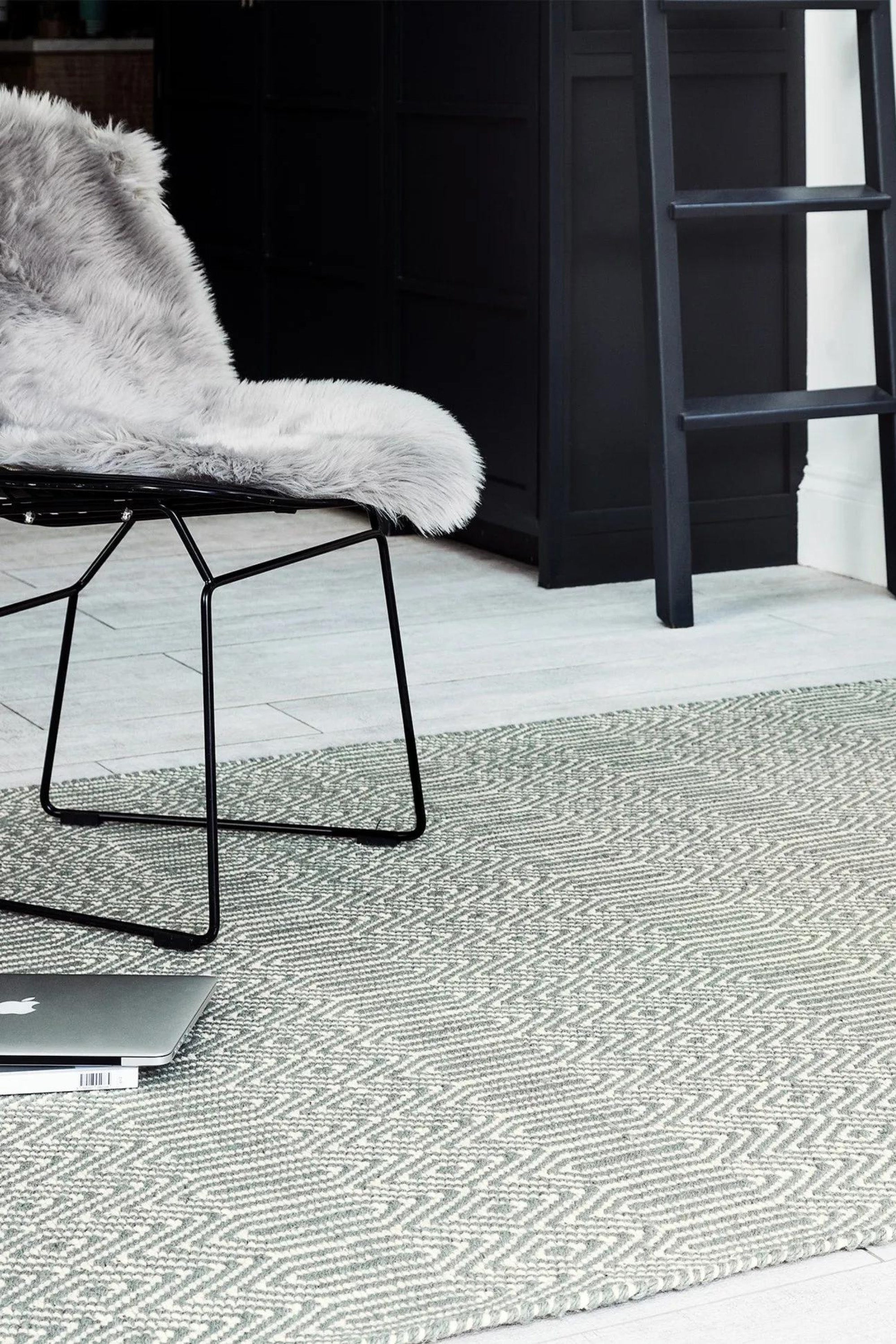 silver and white rug with aztec chevron pattern