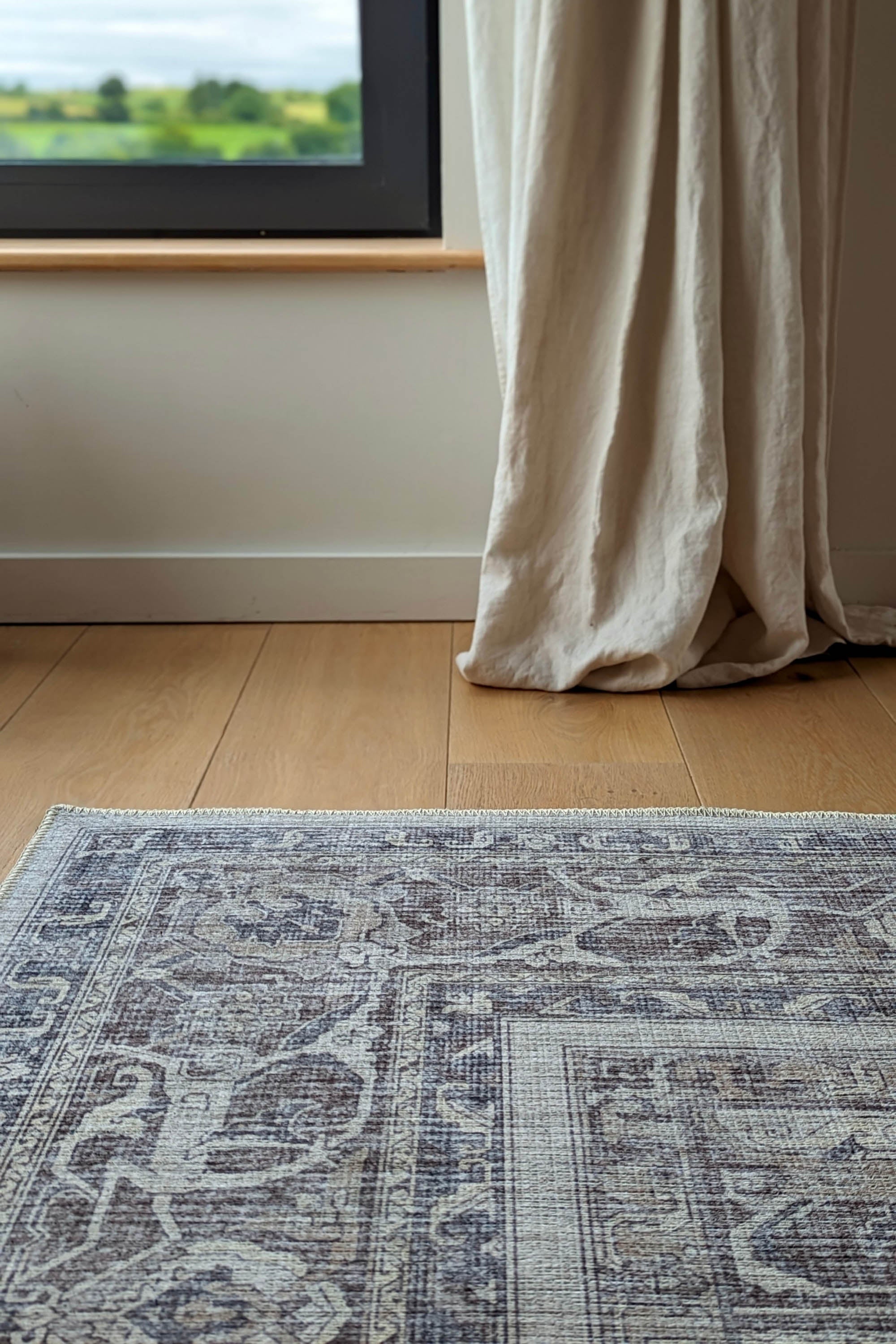 Bordered grey vintage style rug