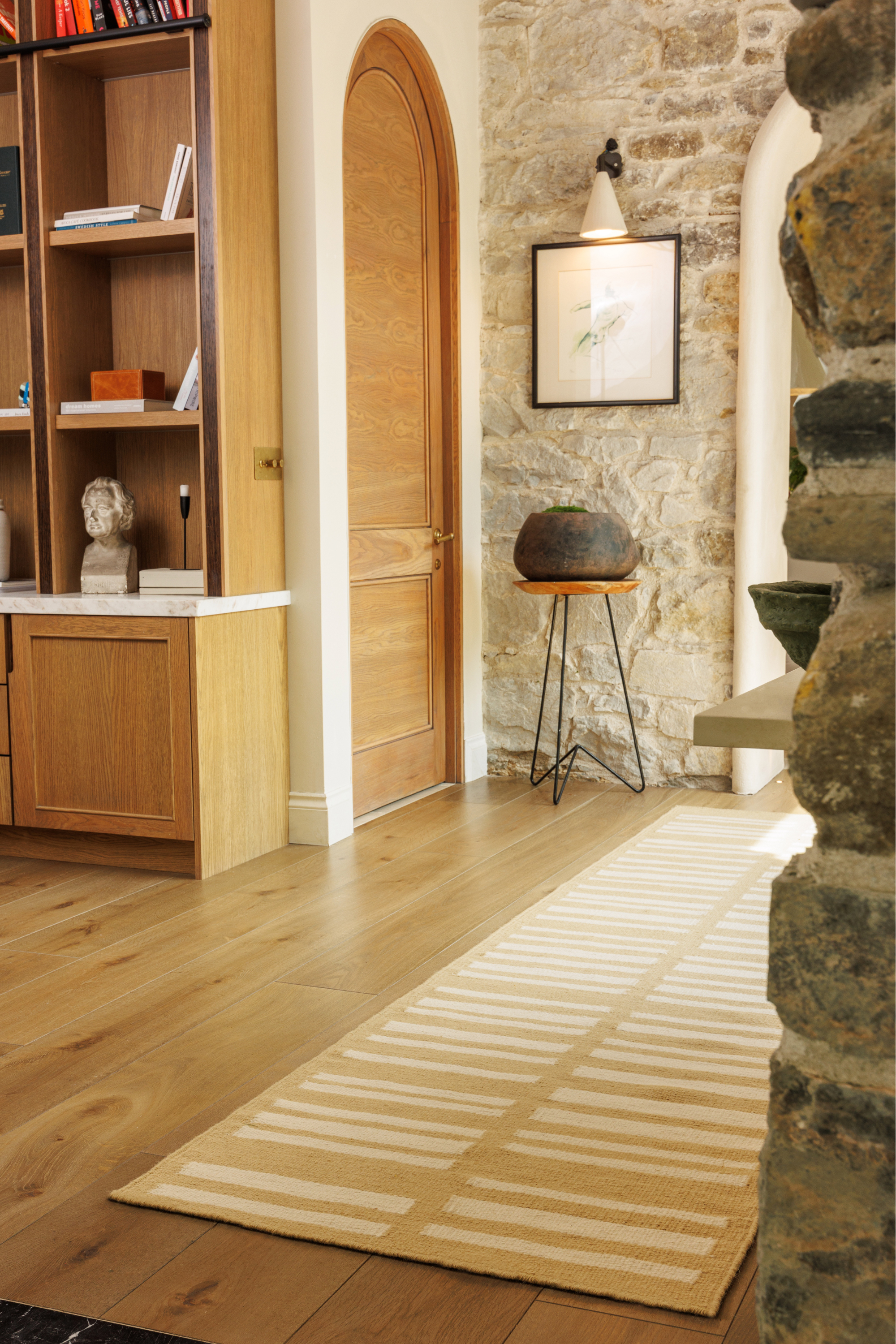 beige and straw toned wool and cotton runner rug featuring an irregular linear pattern in a hallway