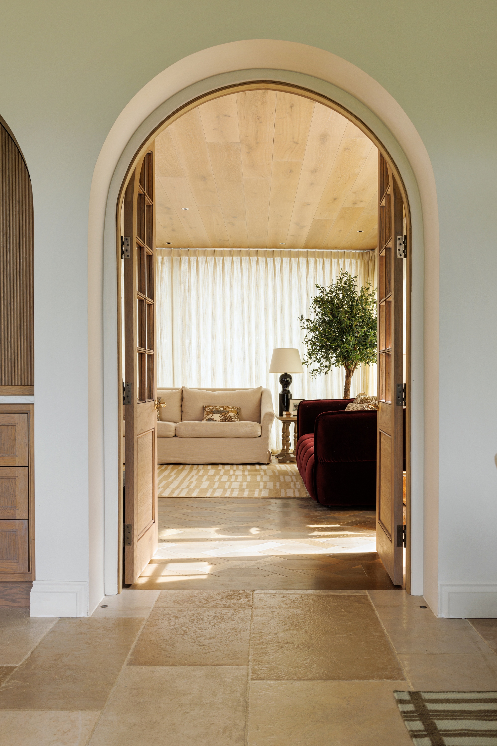 beige and straw toned wool and cotton rug featuring an irregular linear pattern placed in a living room