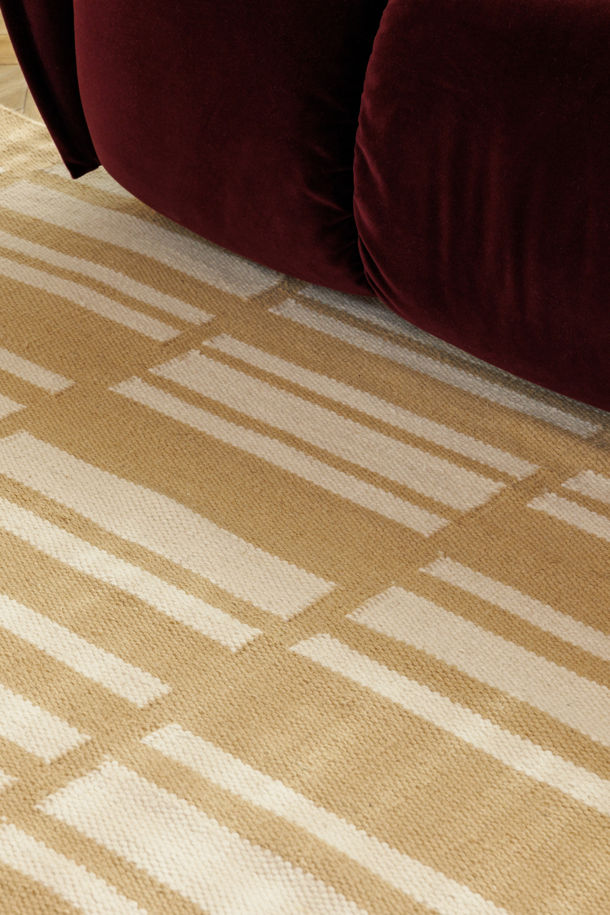 beige and straw toned wool and cotton rug featuring an irregular linear pattern