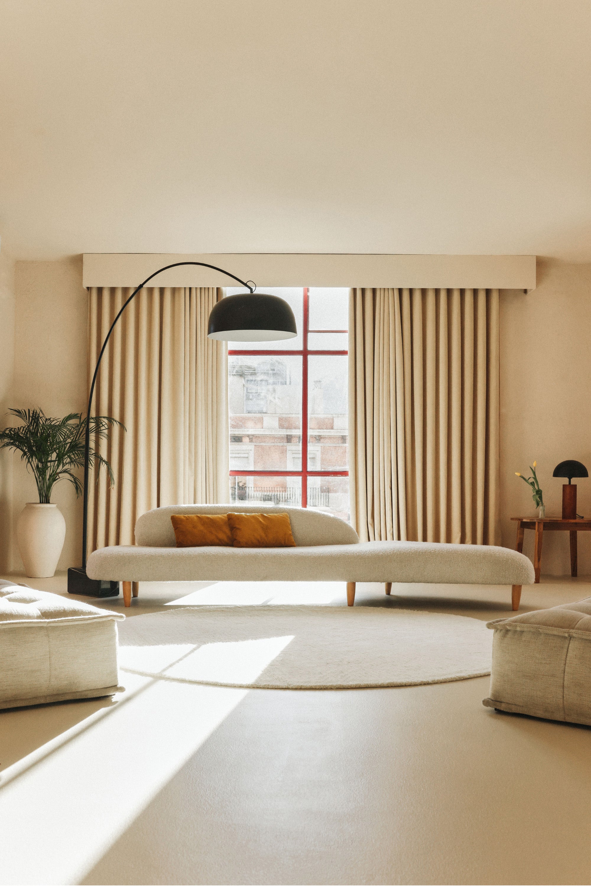 Plain cream round wool rug with soft pile