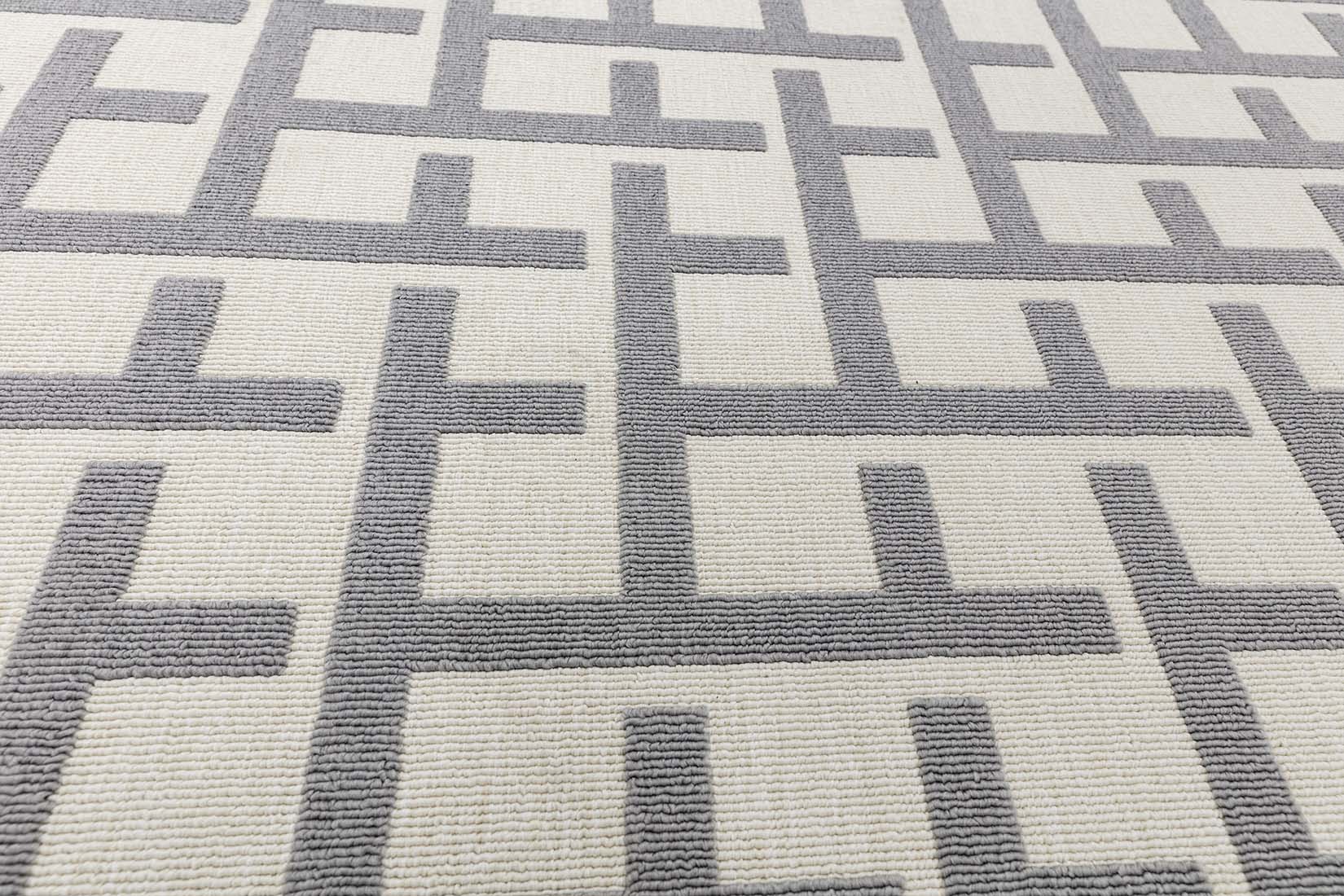 grey indoor/outdoor rug with geometric design
