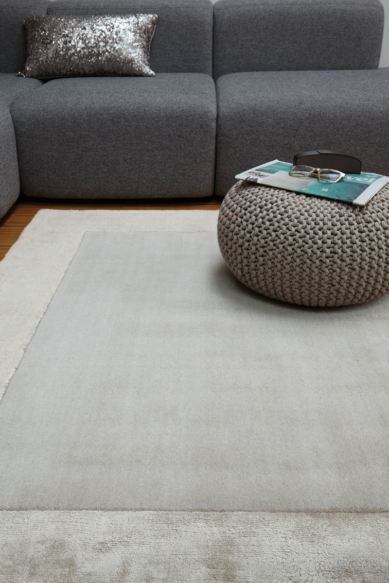 silver wool and viscose rug with a border design