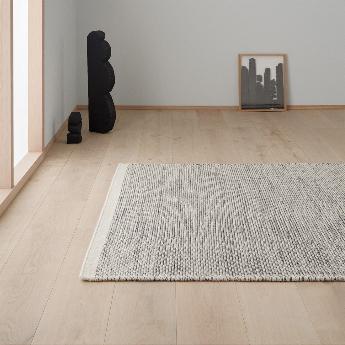 plain cream and black wool rug