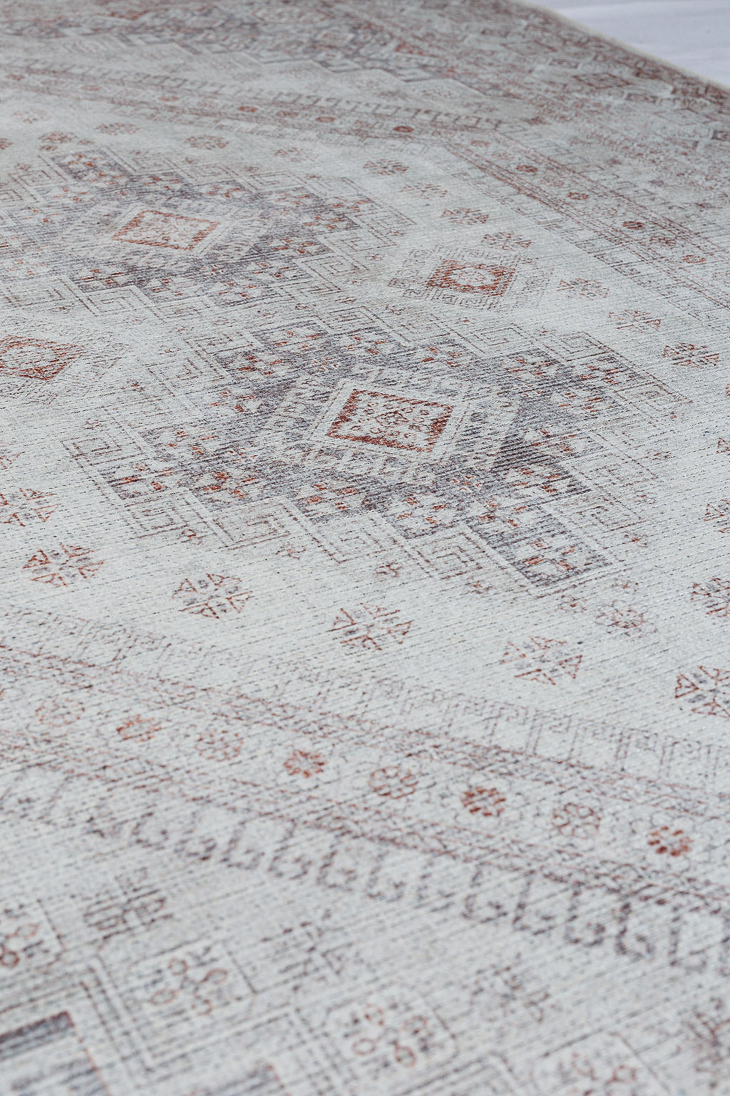 Grey bordered vintage style rug