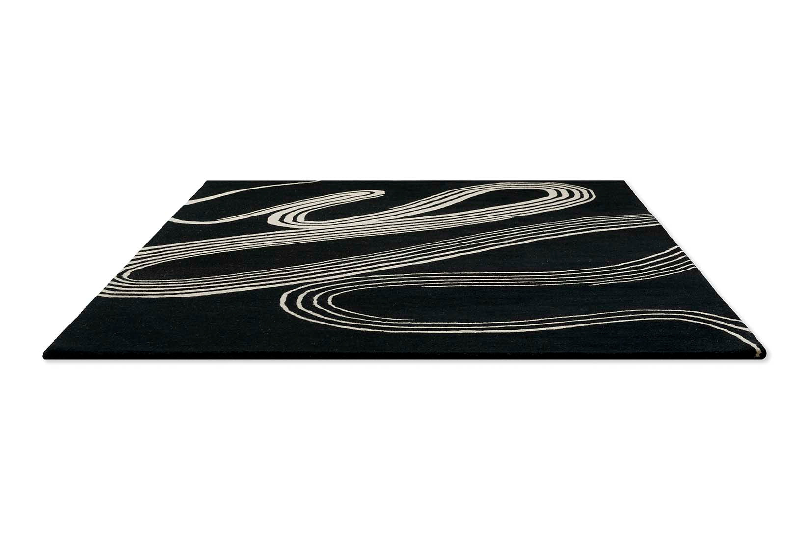 black rug with cream brush strokes