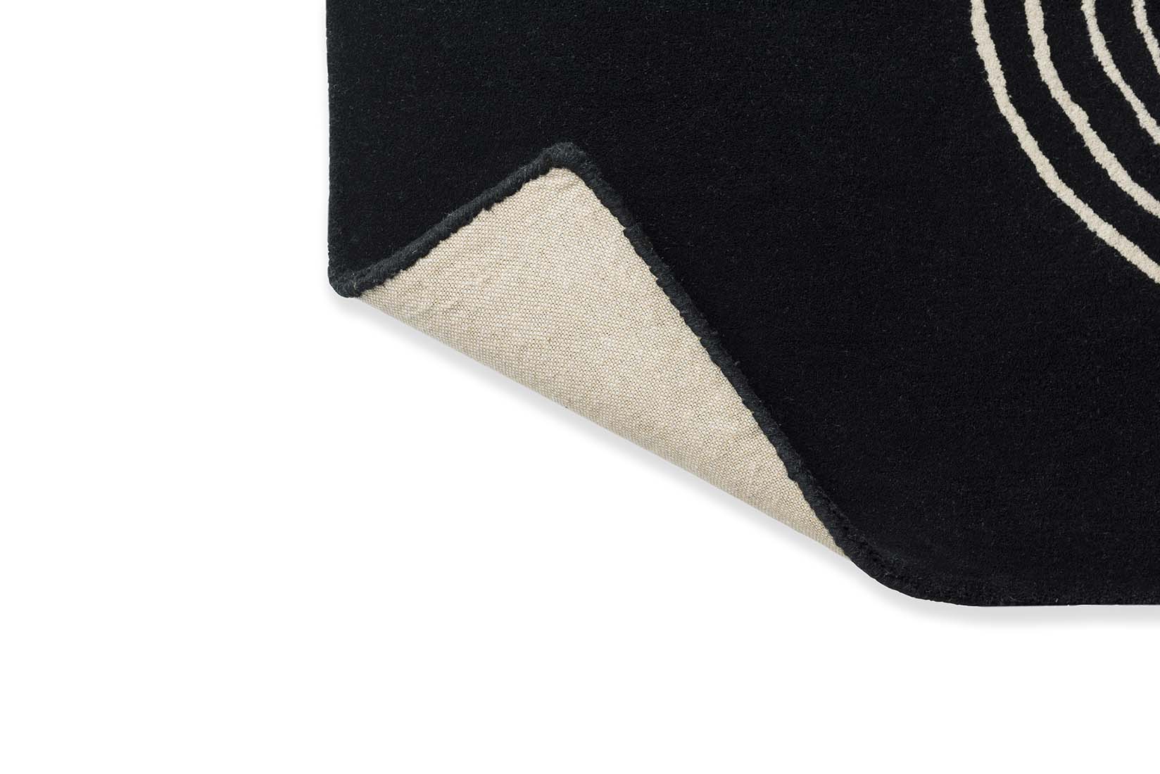 black rug with cream brush strokes
