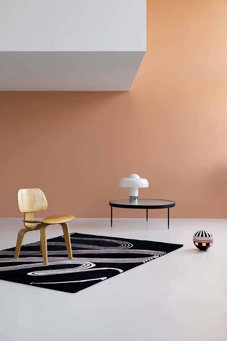 black rug with cream brush strokes