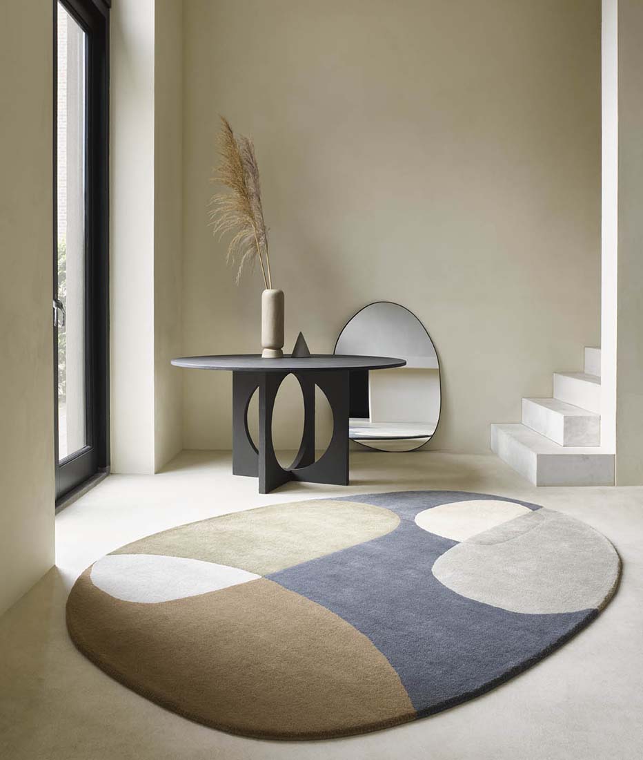 multicolour oval shaped wool rug with abstract design