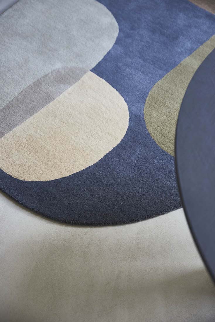 multicolour oval shaped wool rug with abstract design