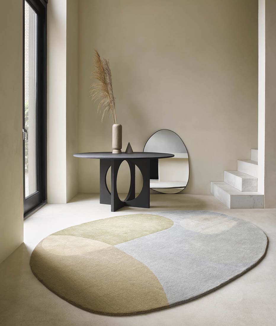 multicolour oval shaped wool rug with abstract design