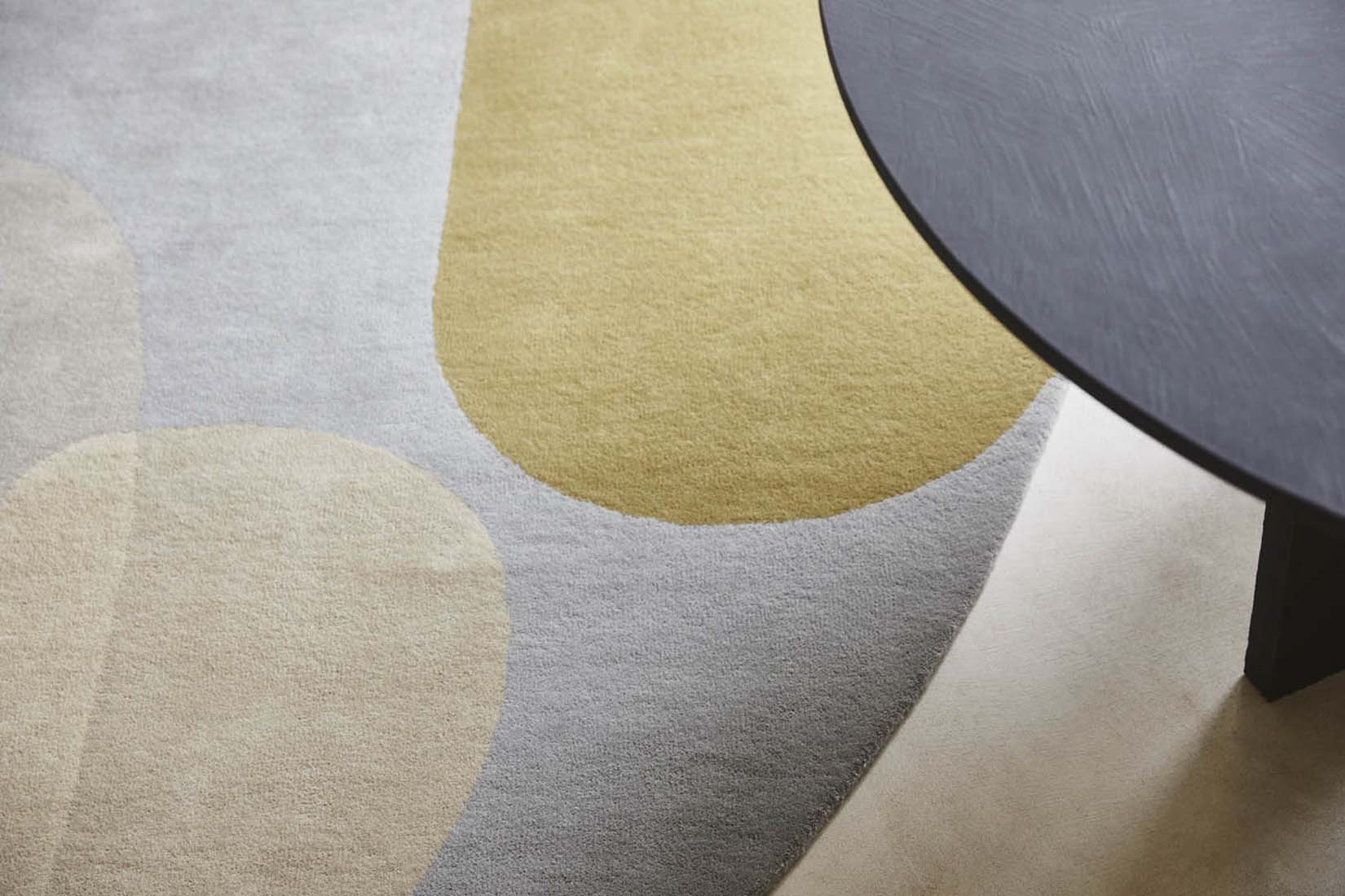 multicolour oval shaped wool rug with abstract design