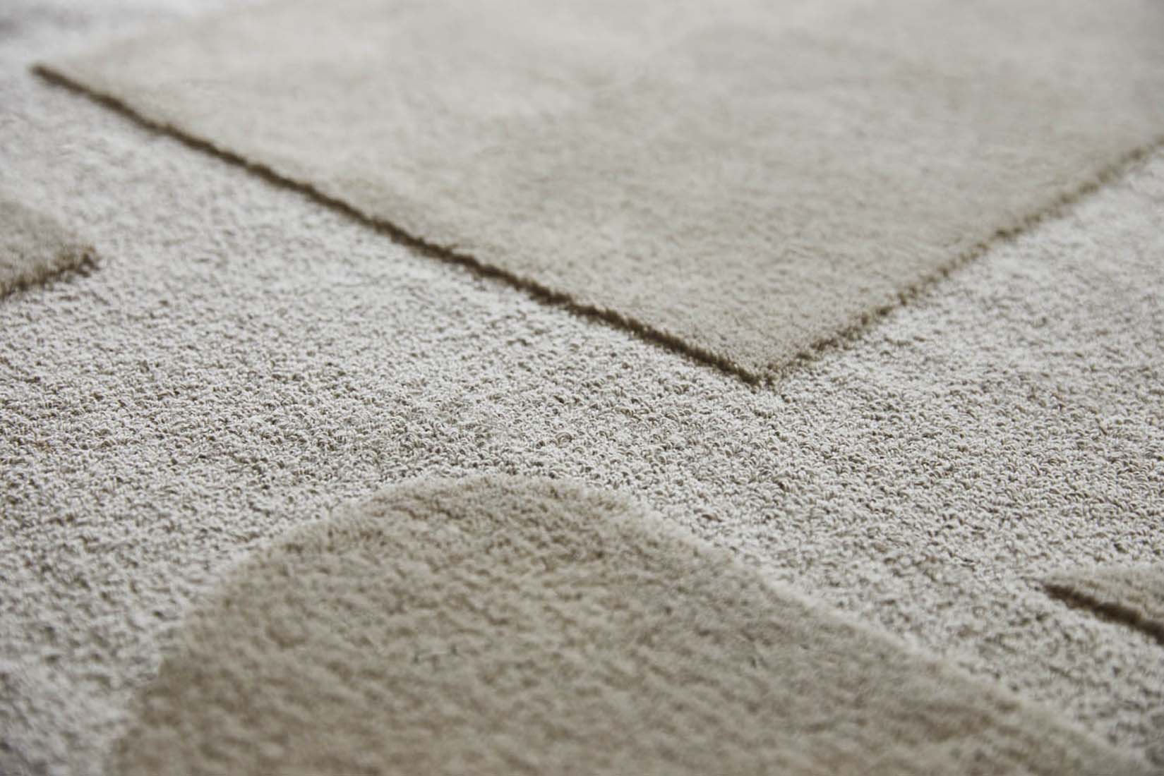 beige wool rug with geometric textured design