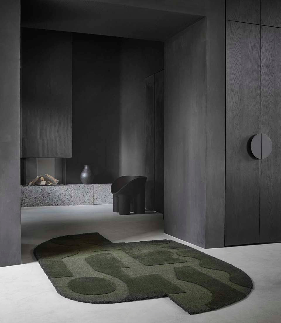 forest green wool rug with geometric textured design