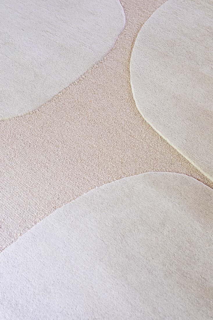 cream rug with cream shapes
