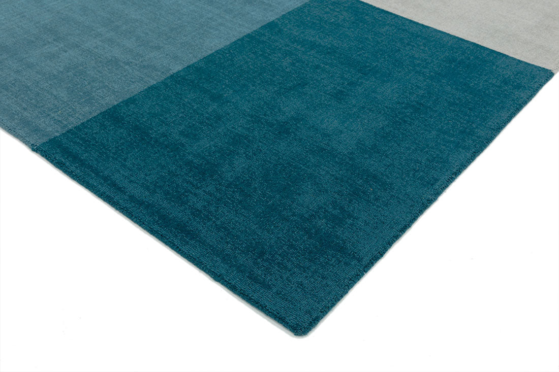 teal blue geometric rug