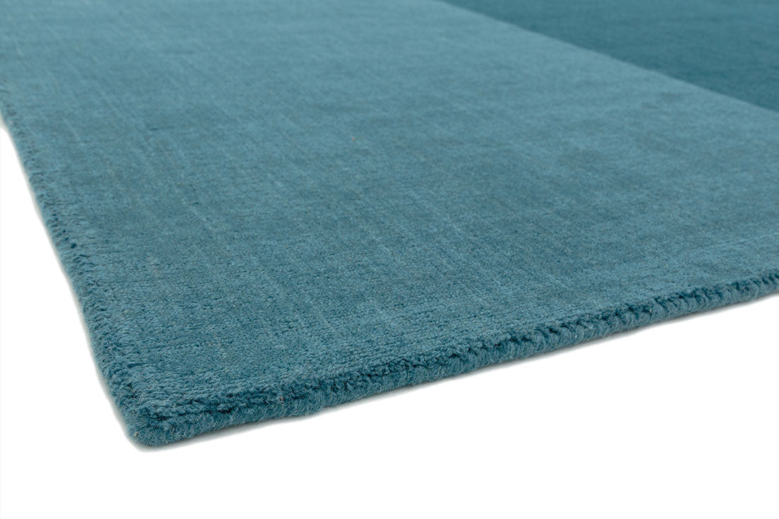 teal blue geometric rug