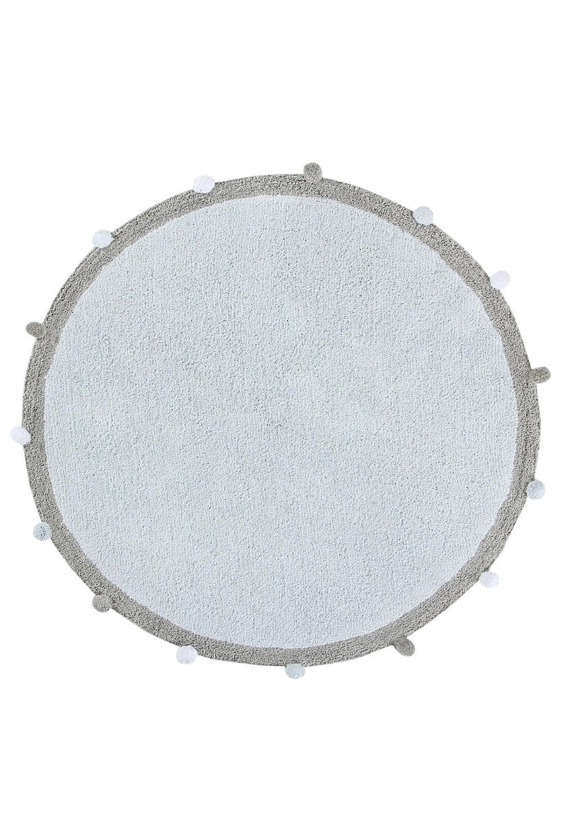 Circular blue cotton rug with grey pom pom border