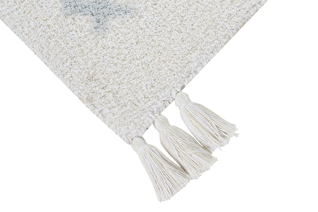 Cream lorena canals cotton rug decorated with shapes and tassels
