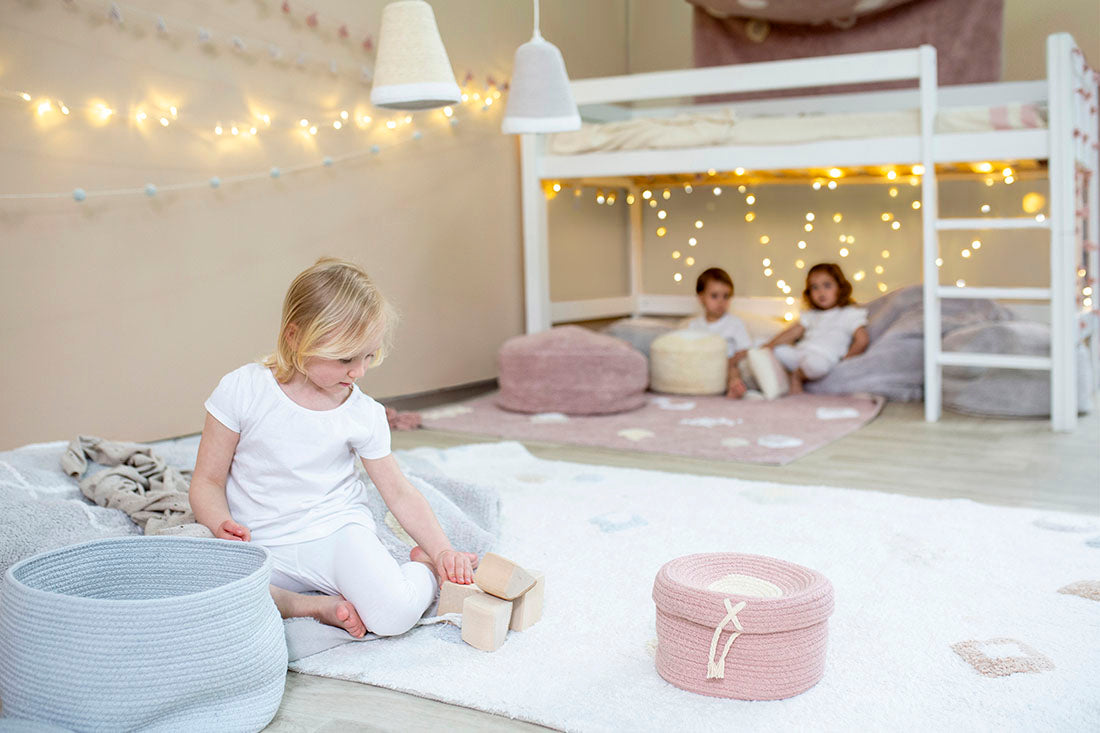 white lorena canals cotton rug decorated with shapes and tassels