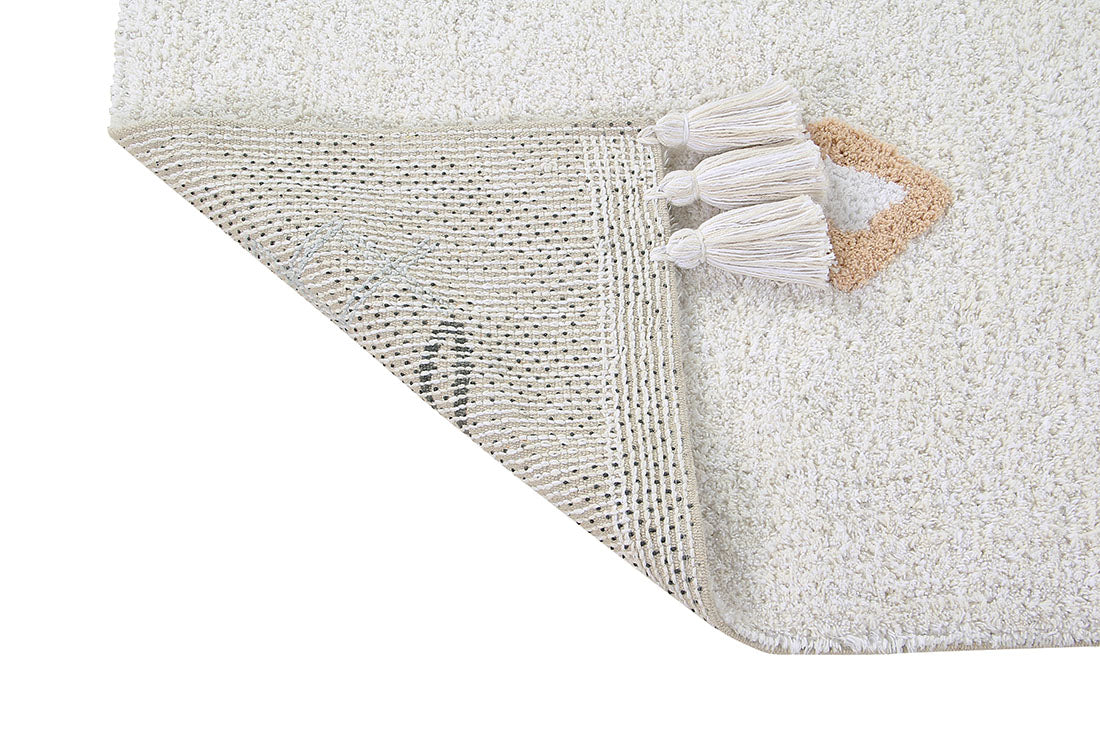 white lorena canals cotton rug decorated with shapes and tassels