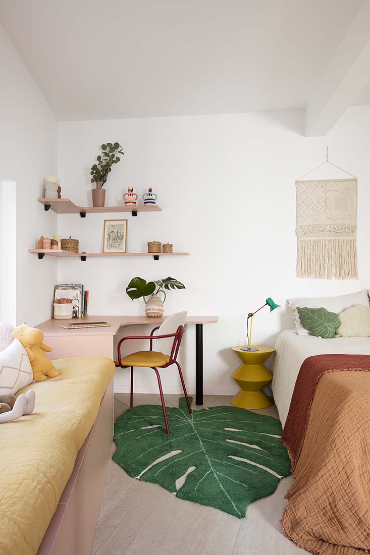 A large green leaf-shaped rug